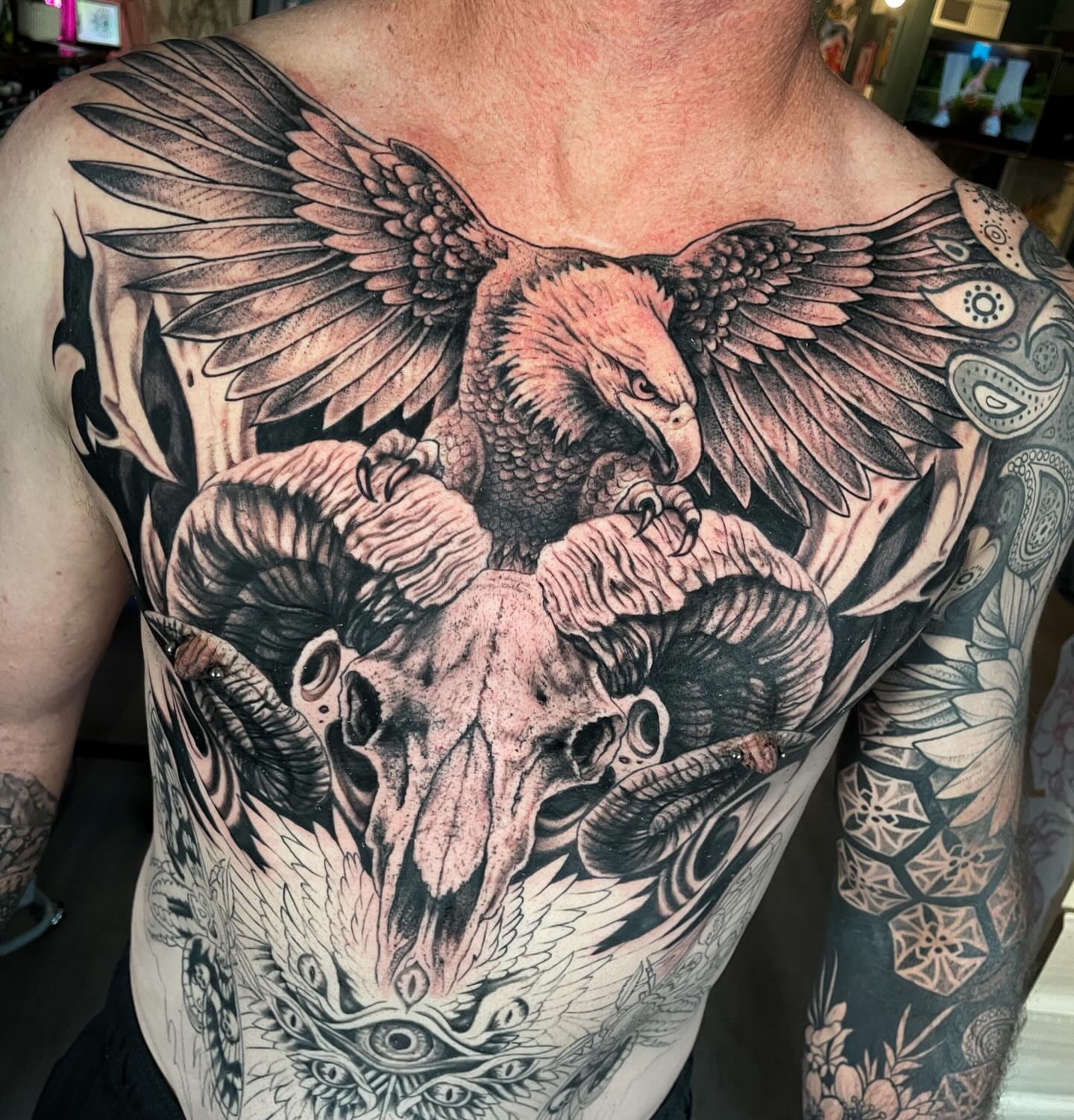Eagle and ram skull realism tattoo on the chest by Dev Z