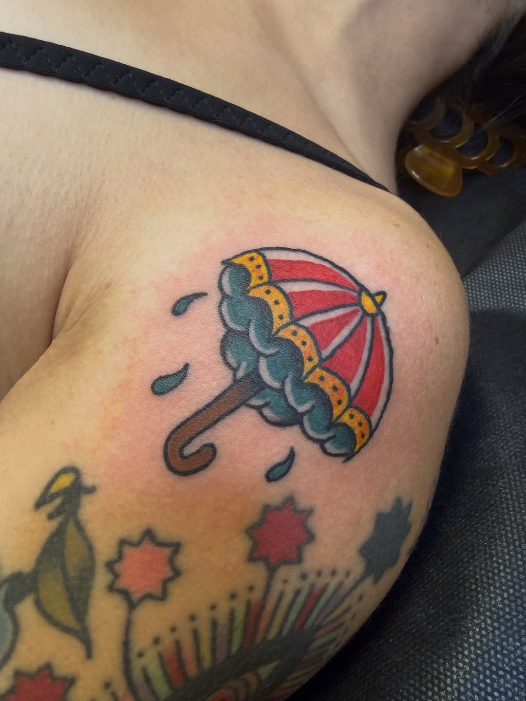 Umbrella with raindrops American traditional tattoo on the shoulder by Nick Tumminello