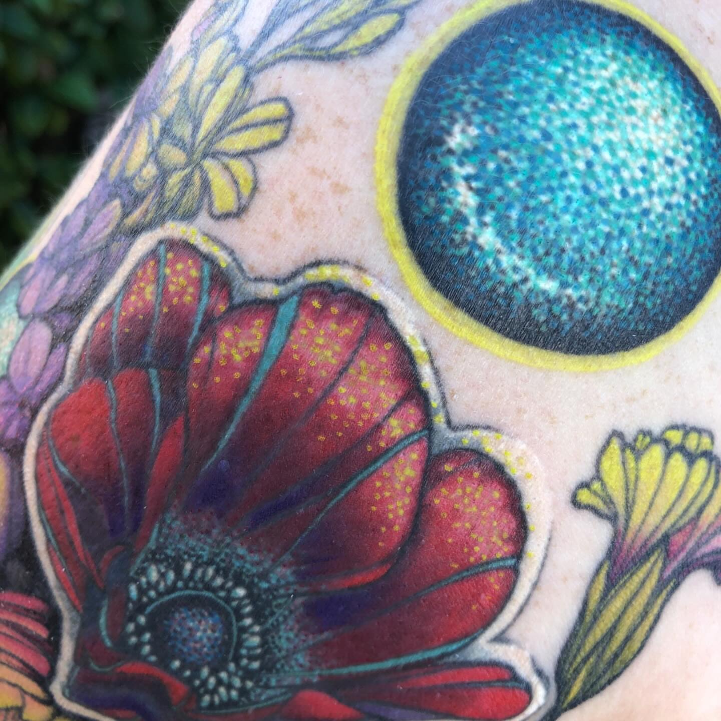 Flower and celestial body dotwork tattoo on the upper arm by LiteBriteTattoo, Salt Lake City, Utah