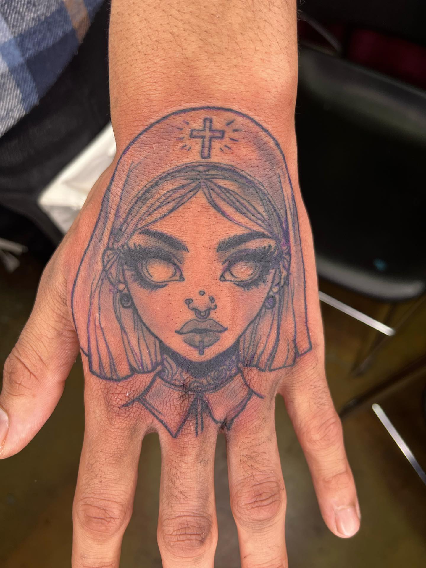 Religious figure black and grey tattoo on the hand by Darius Armour (Tattoo Artist)