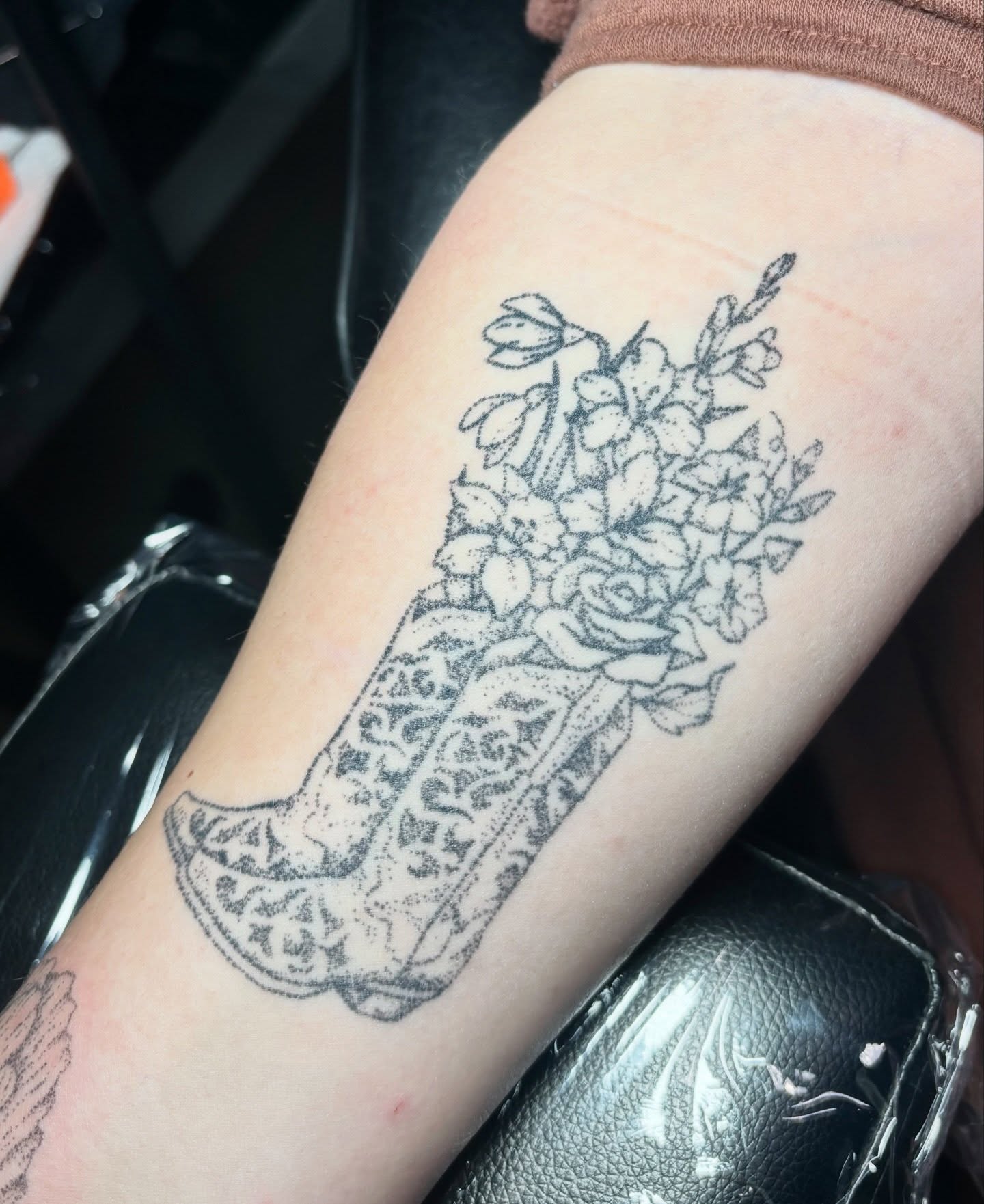 Floral bouquet in shoe dotwork tattoo on the forearm by Ashley, Elk Horn, Iowa