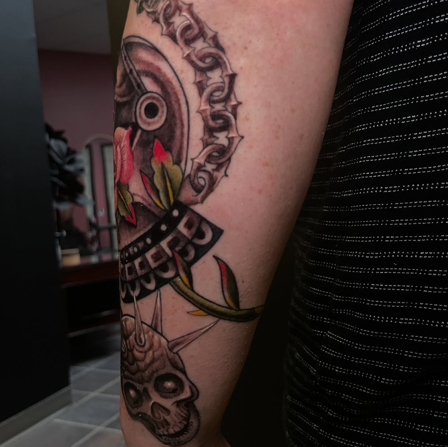 Mechanical gear and rose American traditional tattoo on the forearm by Zachary Hayden