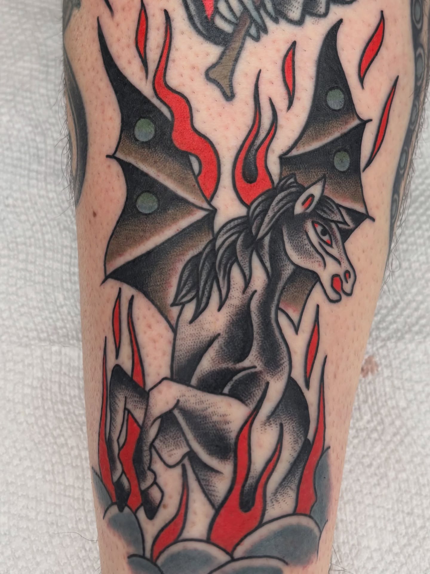 Horse with wings American traditional tattoo on the forearm by Charlie Dunkel Tattoo