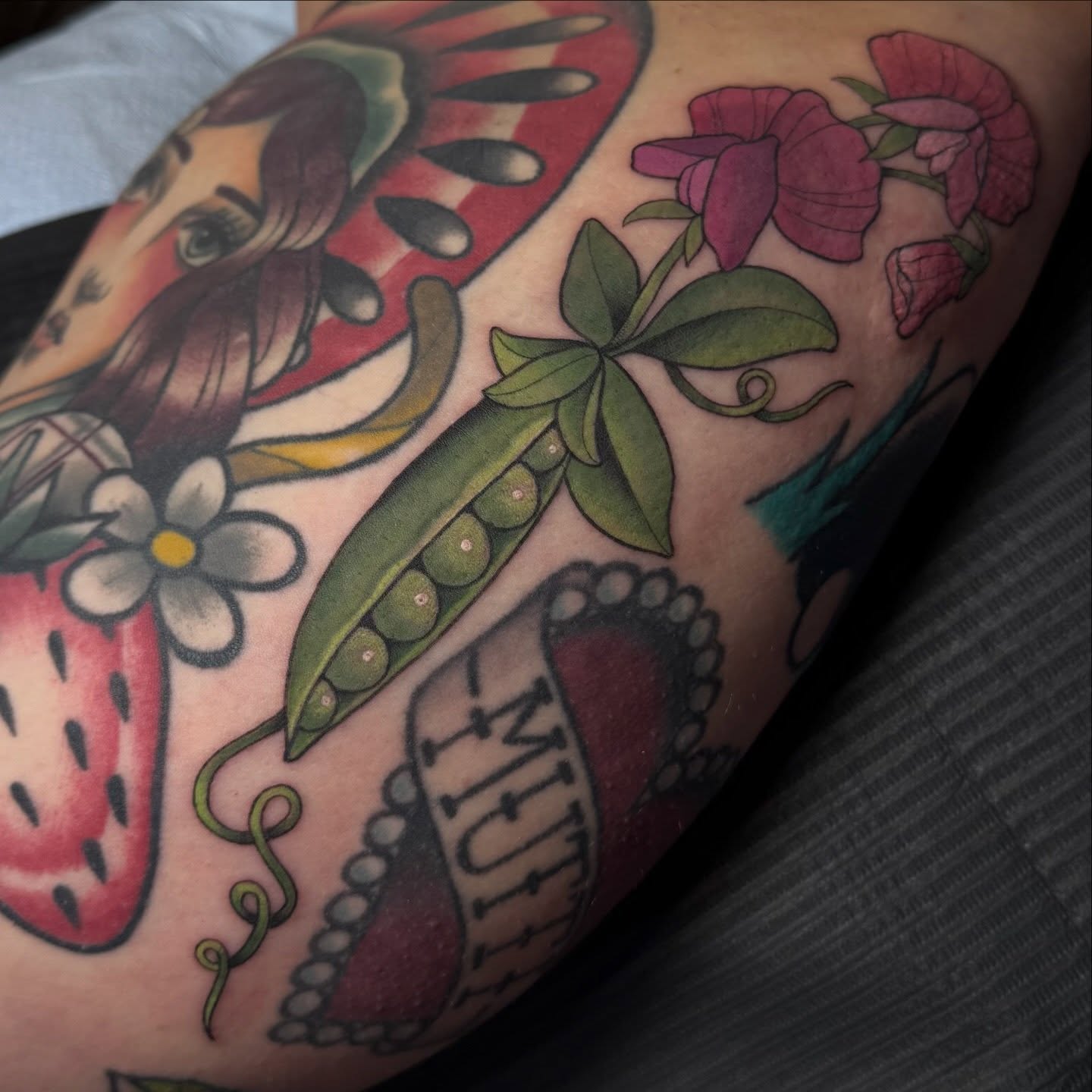 Peach, strawberry, flowers, peas American traditional tattoo on the forearm by Kaley, Des Moines, Iowa