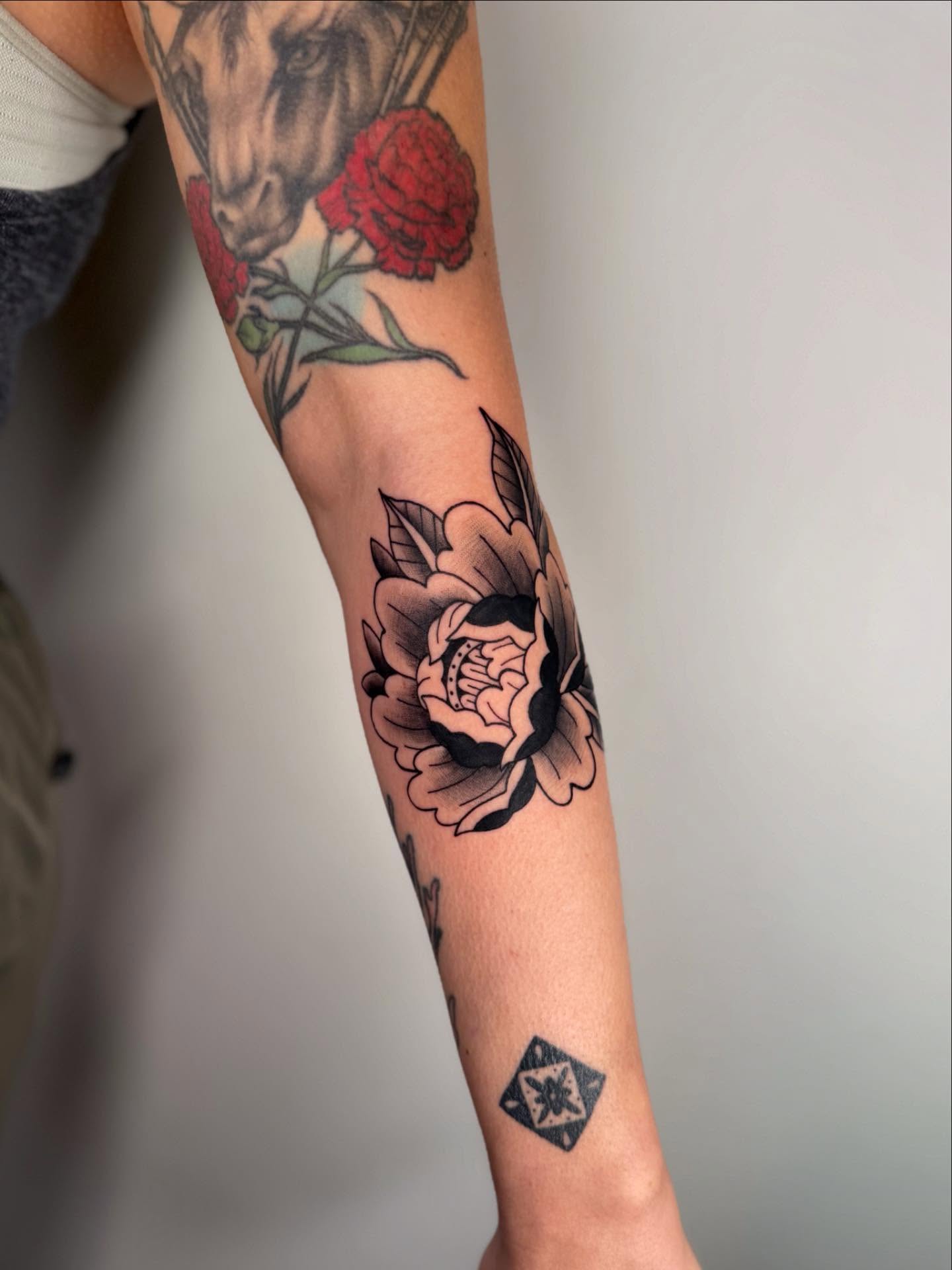 Peony American traditional tattoo on the forearm by Kail