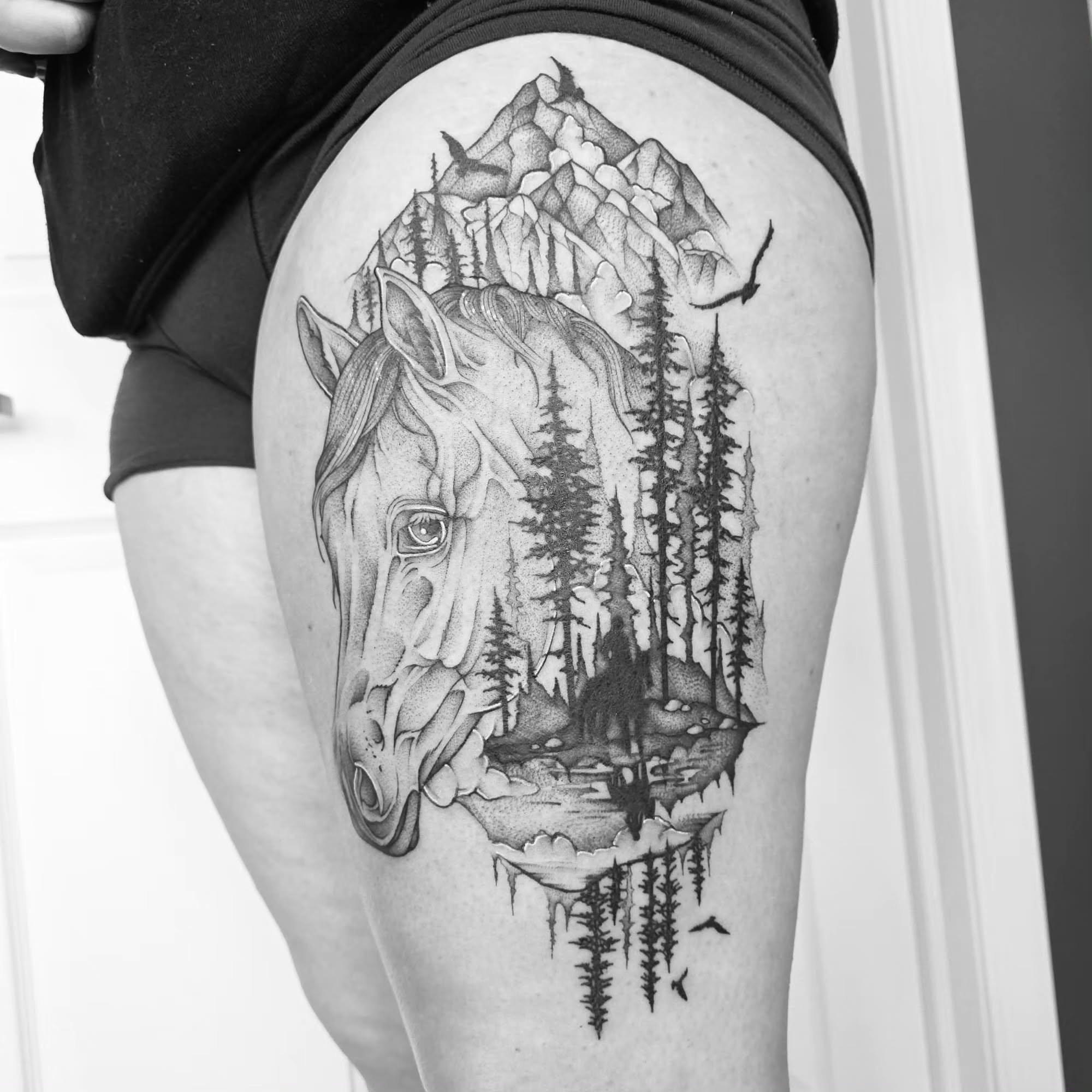 Horse and forest dotwork tattoo on the thigh by Dani Bond