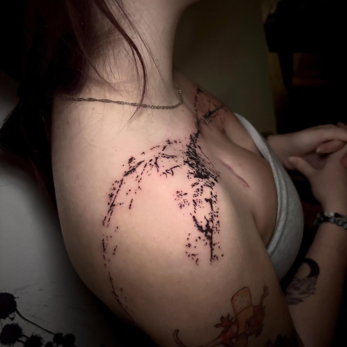 Abstract splatter dotwork tattoo on the shoulder by unknown liquids tattoo