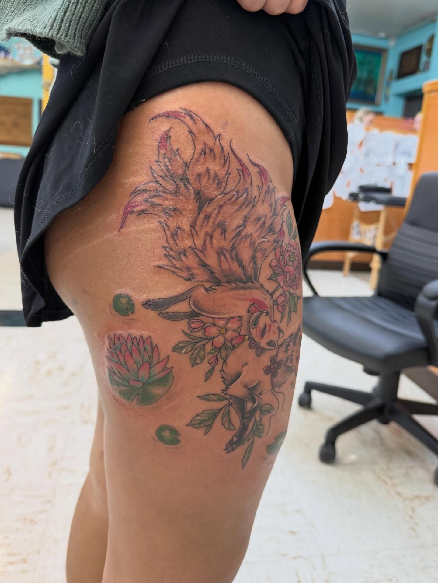 Bird and floral American traditional tattoo on the thigh by Levi Sawdon, Everett, Washington