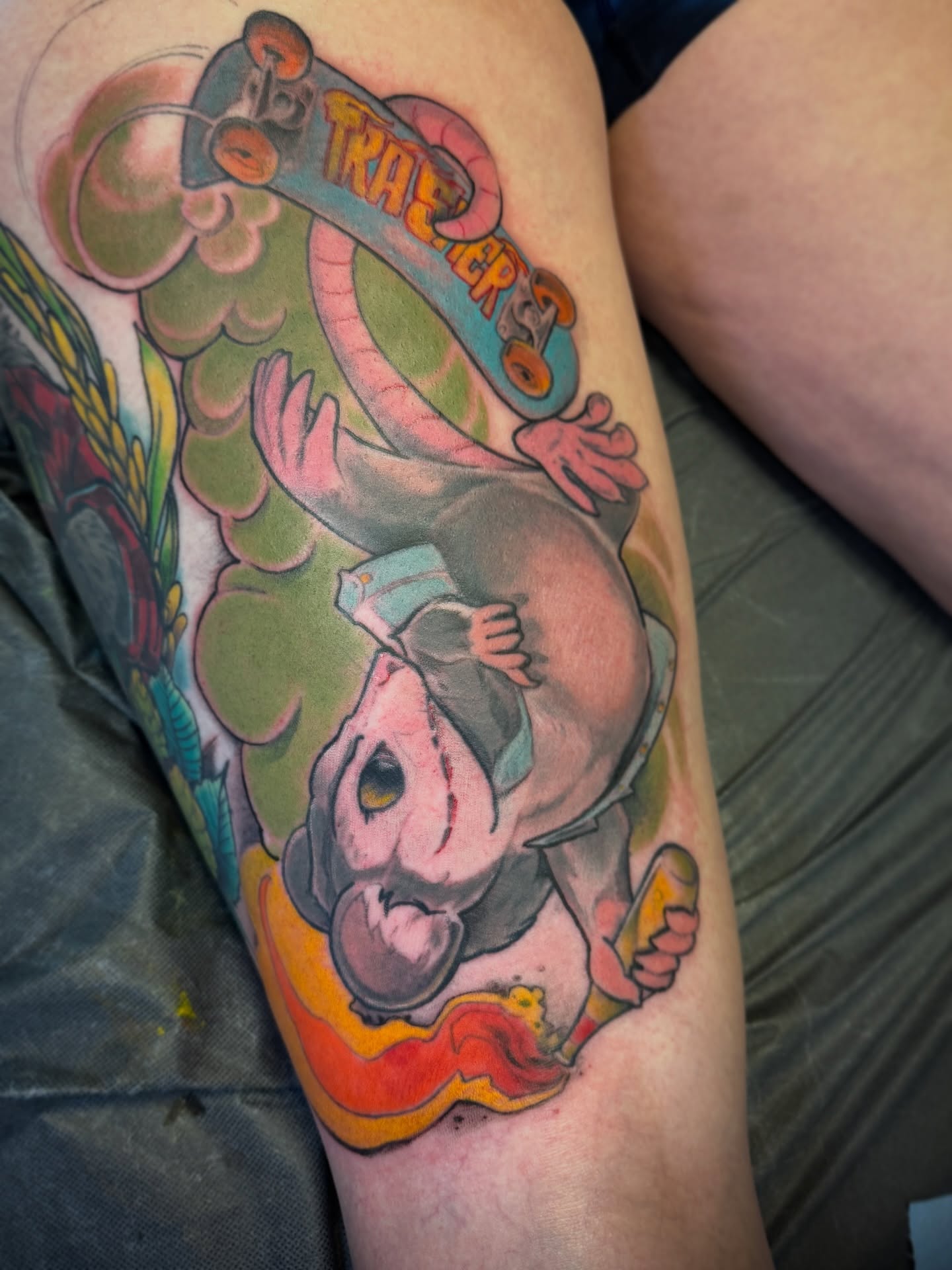 Rhino with skateboard new school tattoo on the thigh by Joe Hall