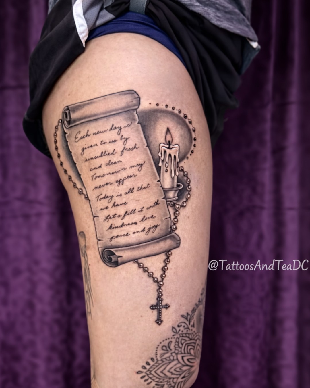 Scroll with text realism tattoo on the thigh by Tattoos & Tea DC, Arlington, Virginia
