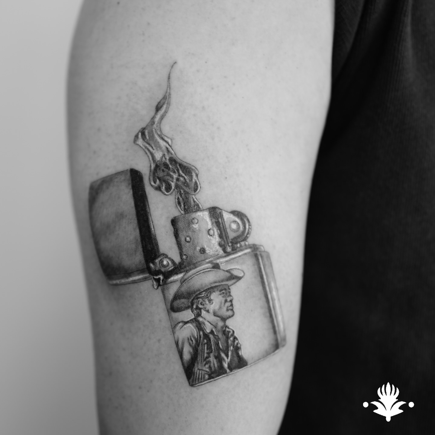Lighter with cowboy realism tattoo on the forearm by Ross Clark Tattoos