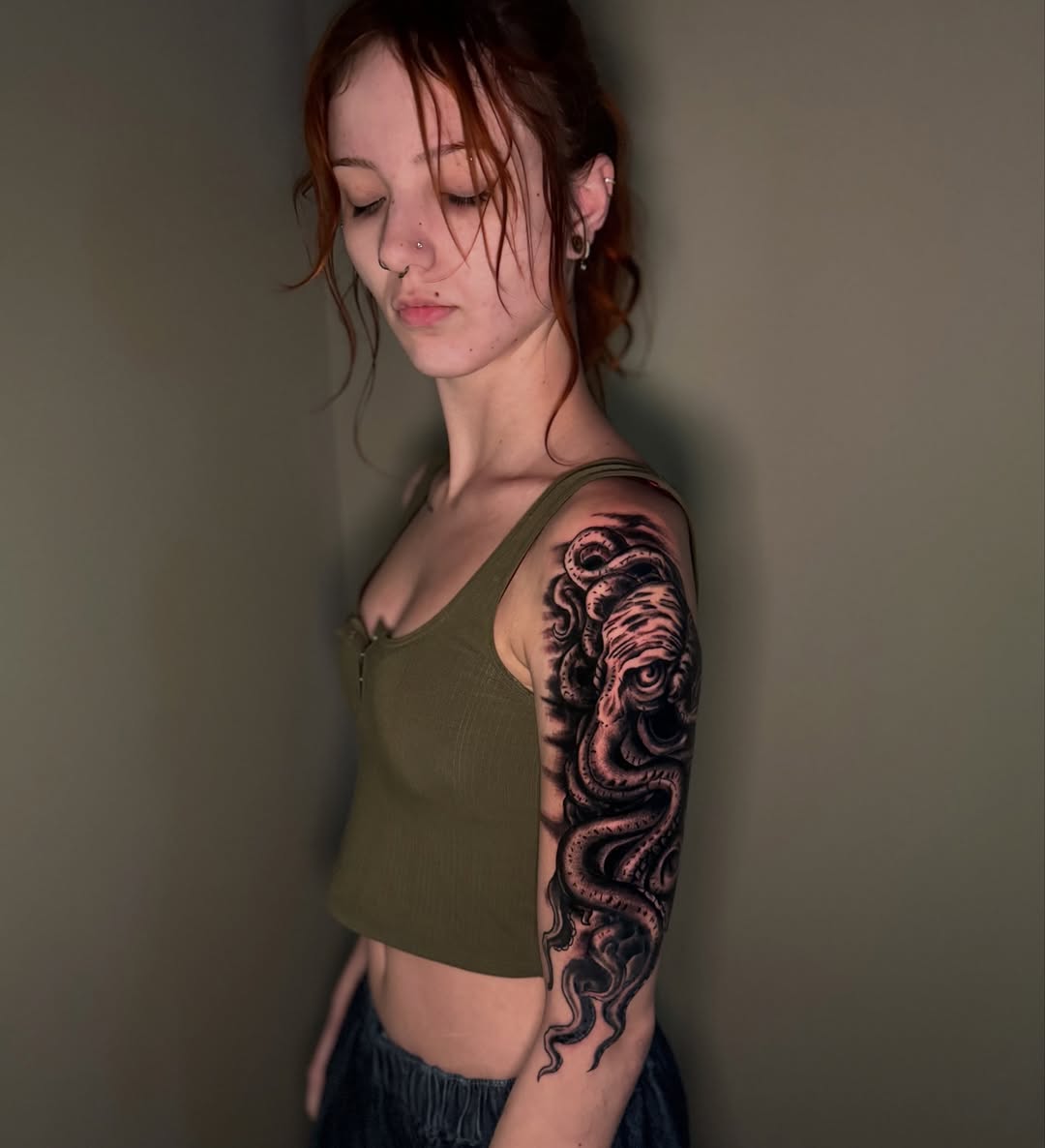 Kraken face and tentacles realism tattoo on the upper arm by spikecitytattoo