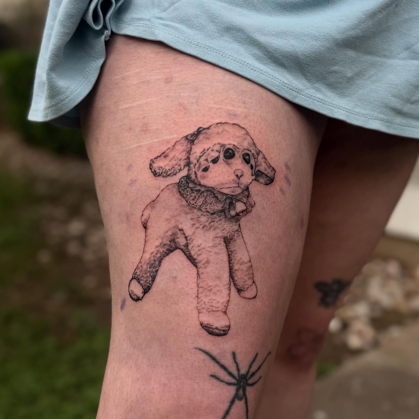 Stuffed lamb black and grey tattoo on the thigh by Cullen-Lee