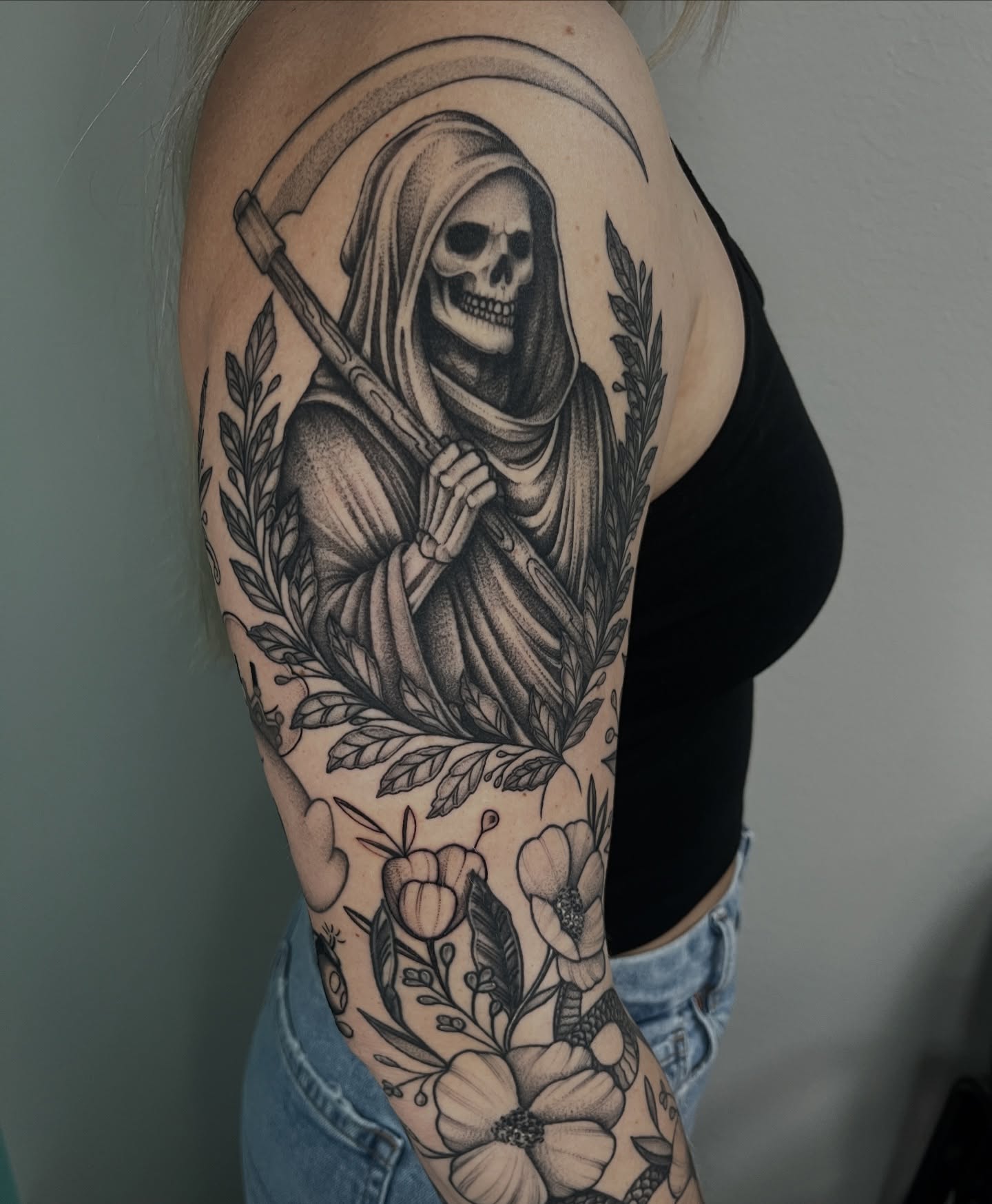 Grim reaper realism tattoo on the upper arm by Jordan Hunt
