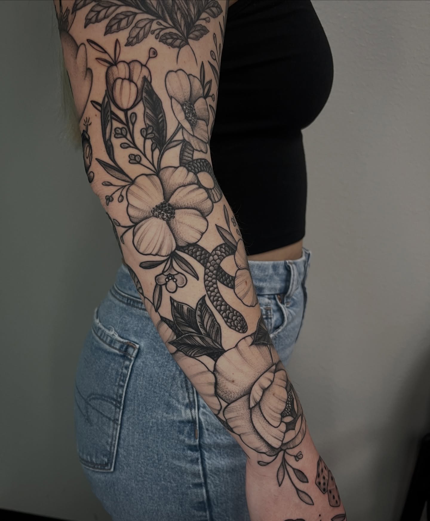 Floral bouquet dotwork tattoo on the forearm by Jordan Hunt