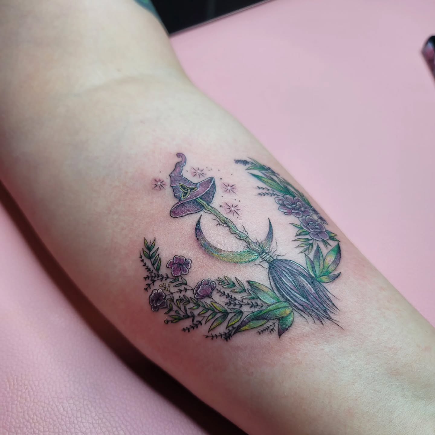 Witchcraft elements new school tattoo on the forearm by Mary Lefeau