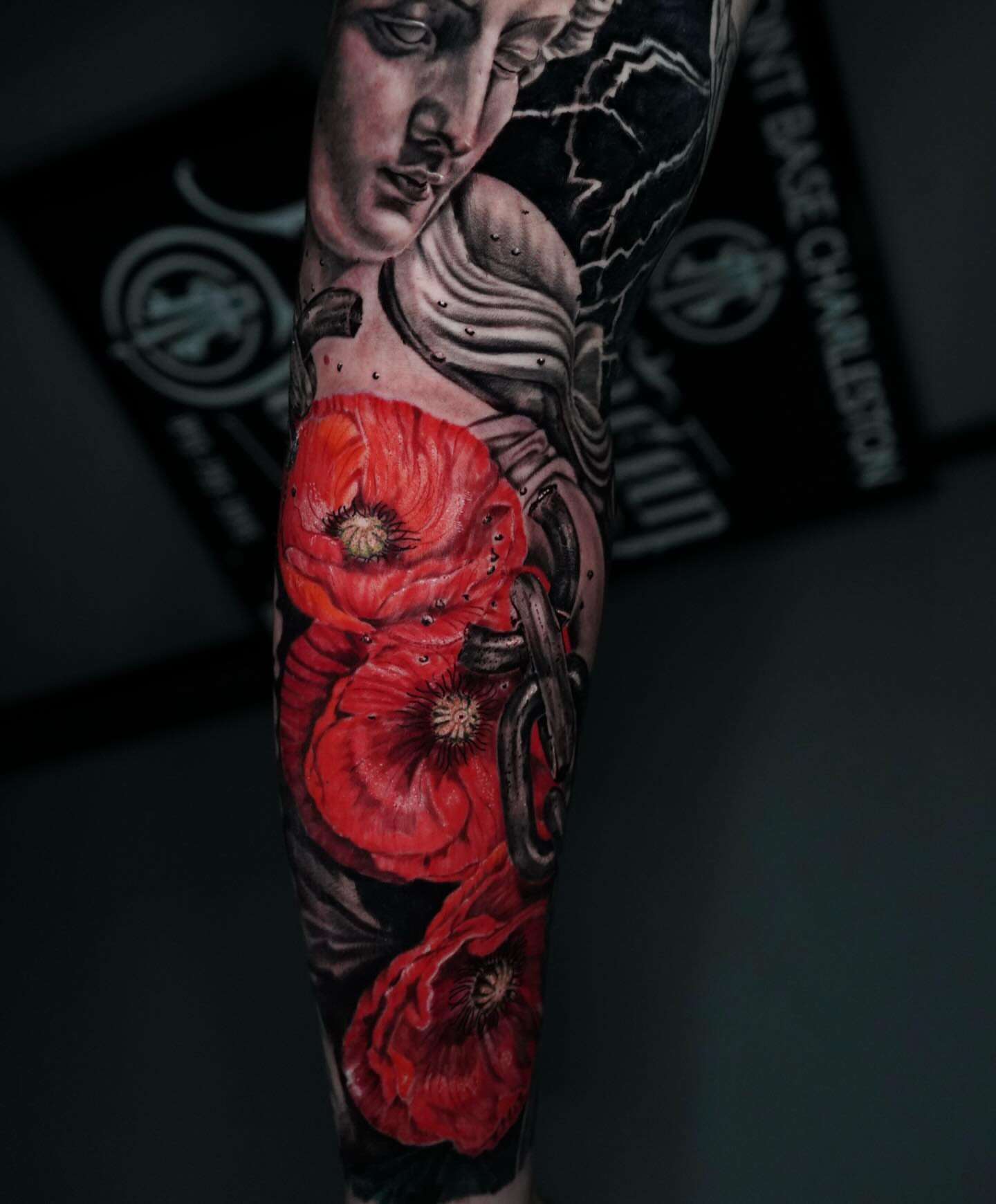 Poppy flowers realism tattoo on the forearm by Carlos Trujillo