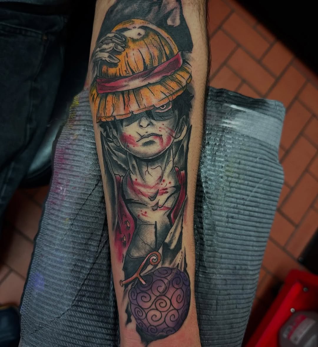 Monkey D. Luffy from One Piece anime tattoo on the forearm by Greyson Heidenreich