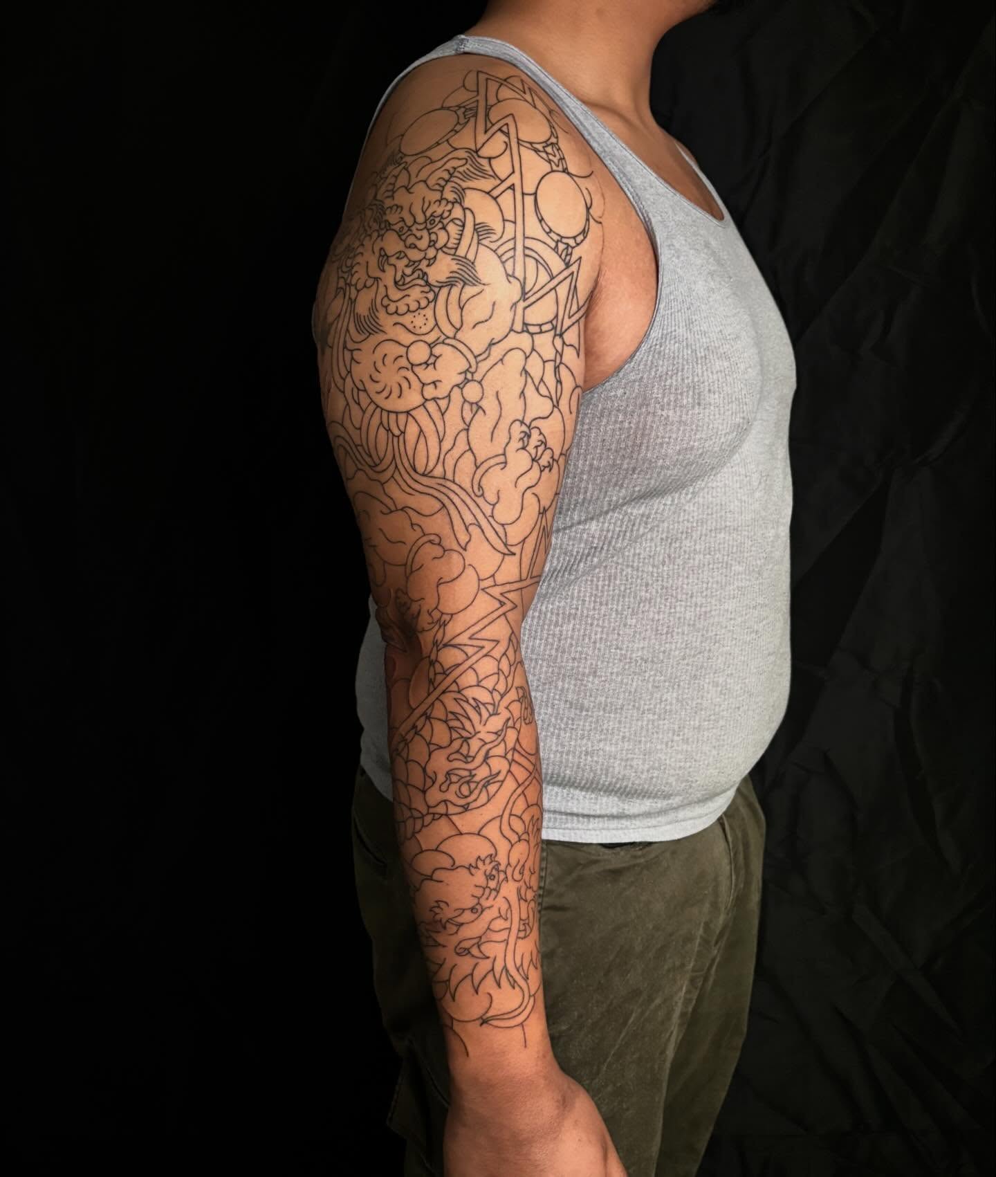 Mythical creature japanese irezumi tattoo on the upper arm by Zach Hendrickson