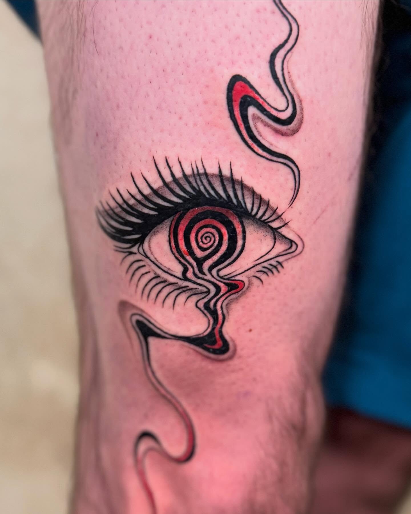 Eye with swirling pattern surrealism tattoo on the forearm by Erin Blaney