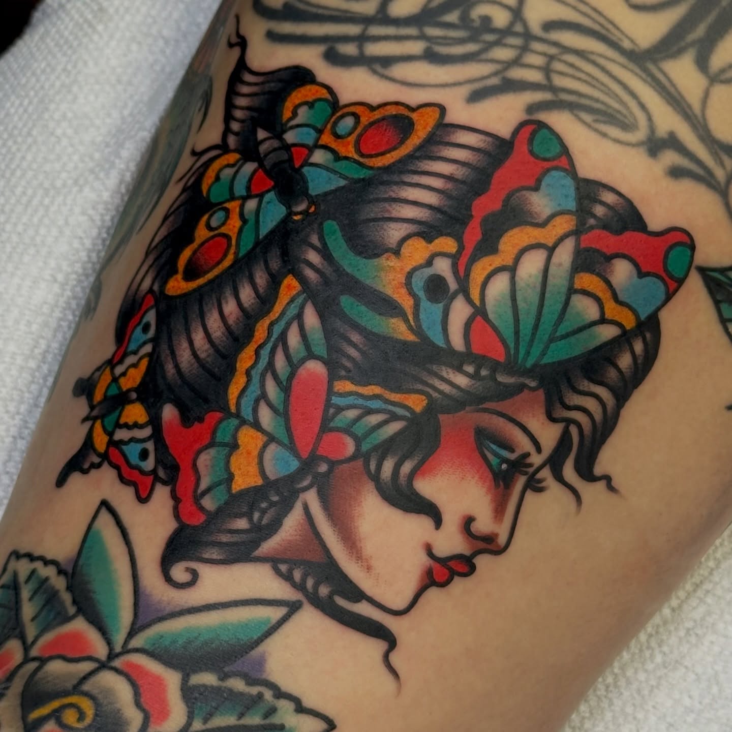 Woman with butterflies American traditional tattoo on the forearm by Amanda Bonhomme, Las Vegas, Nevada