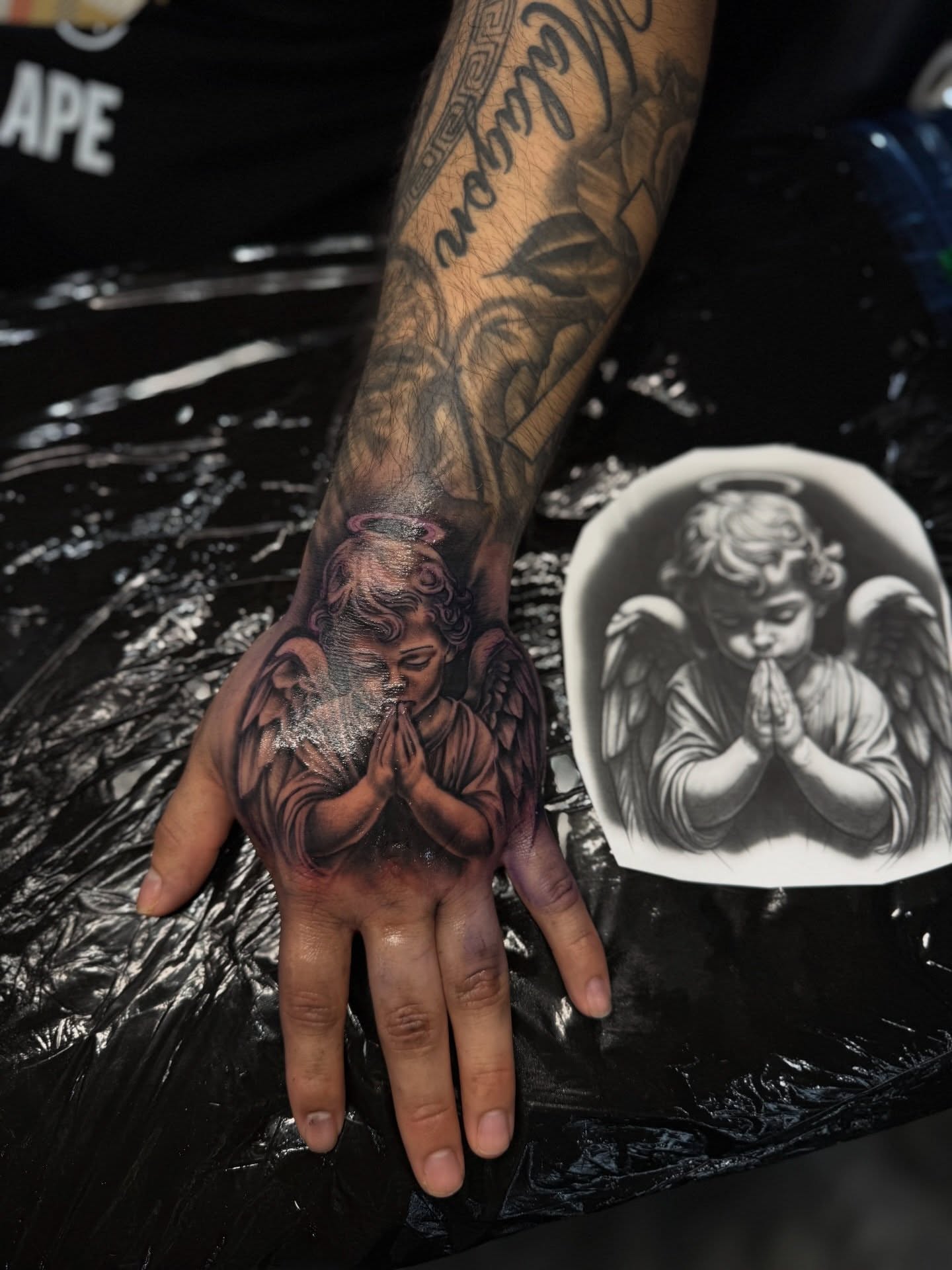 Praying angel realism tattoo on the hand by Santi🎲