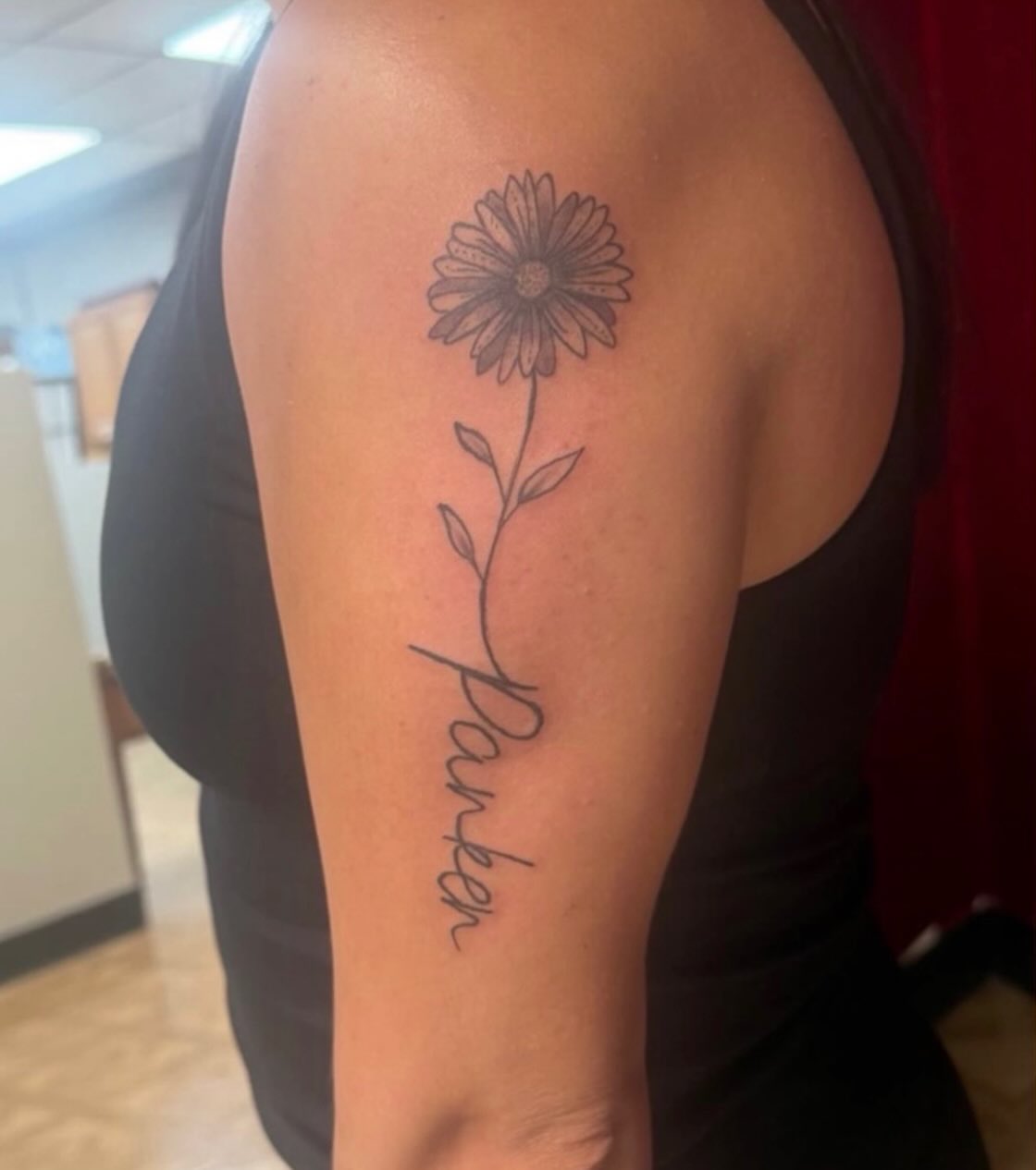 Flower with name black and grey tattoo on the forearm by Natalie Jade Shupe