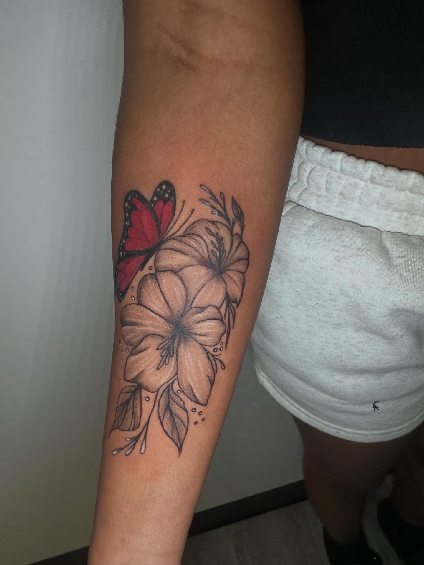 Butterfly and flowers dotwork tattoo on the forearm by Javierr Jimenezz