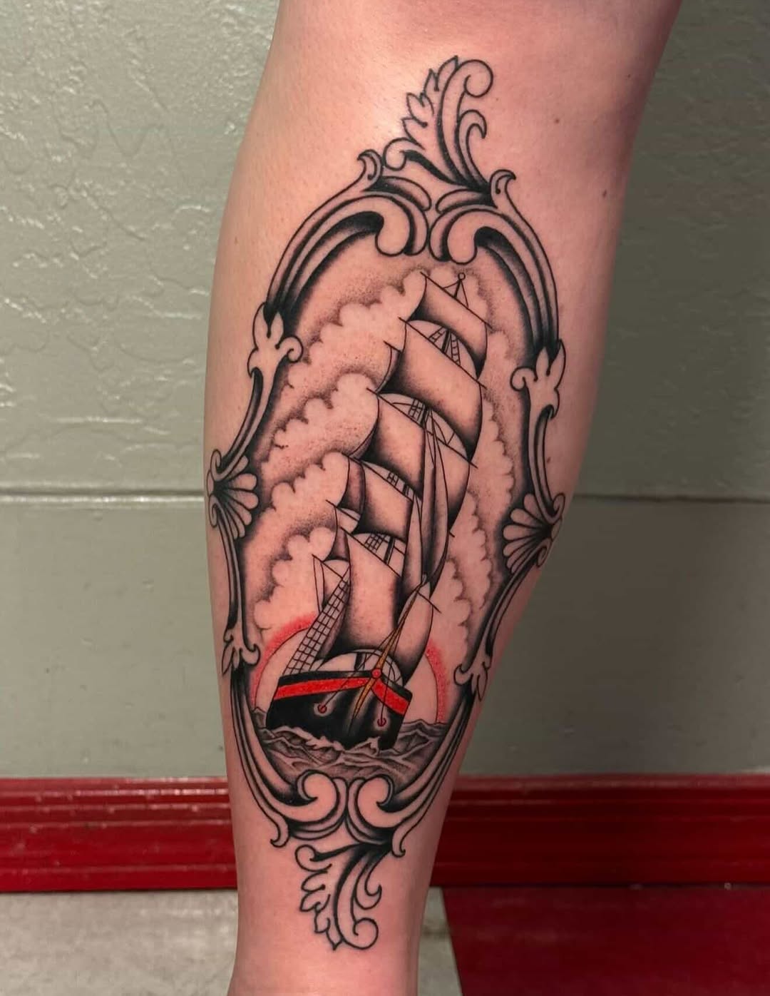 Ship in a frame dark art tattoo on the forearm by Matthew Ulrich