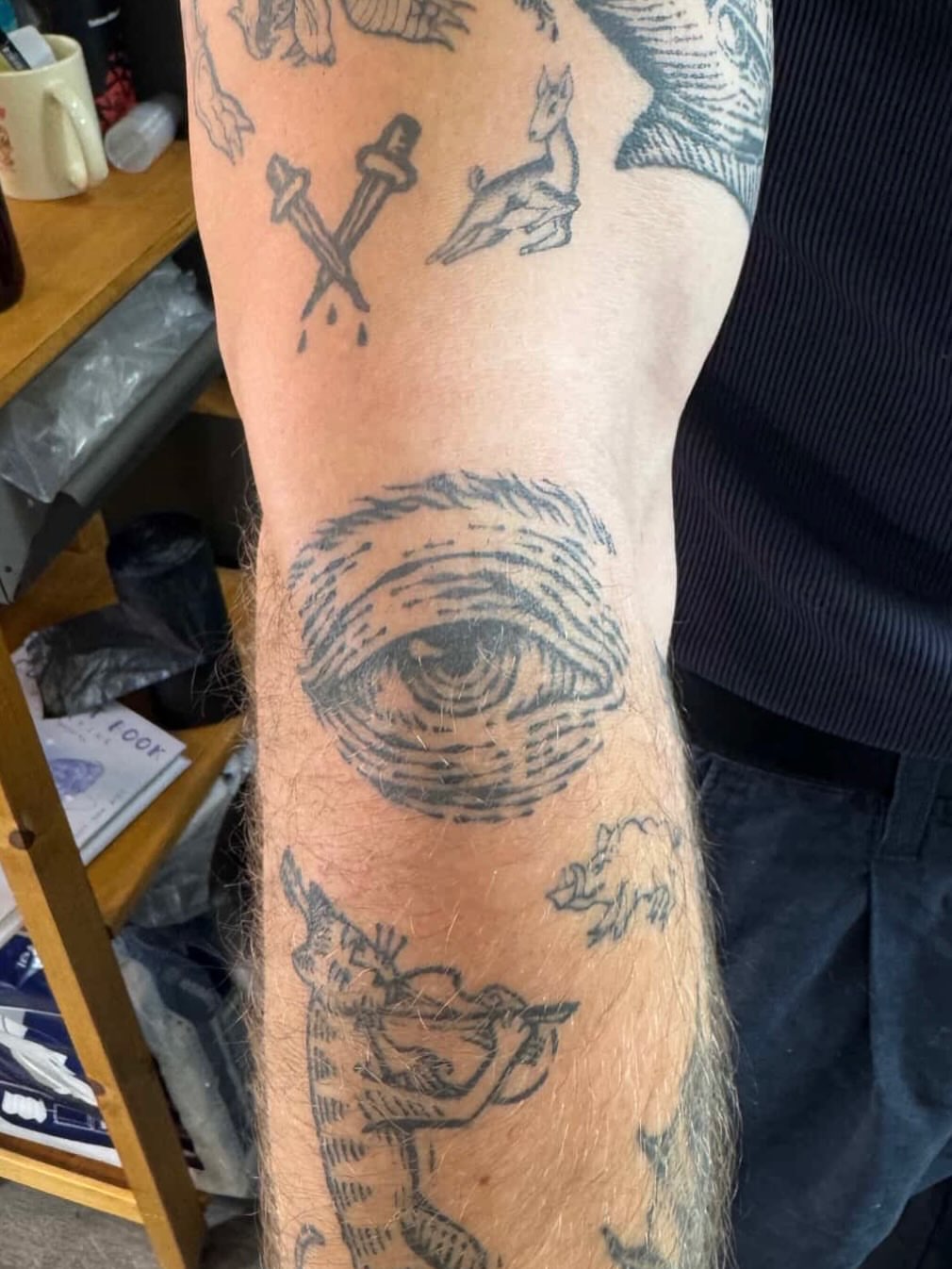 Eye black and grey tattoo on the forearm by Wonny