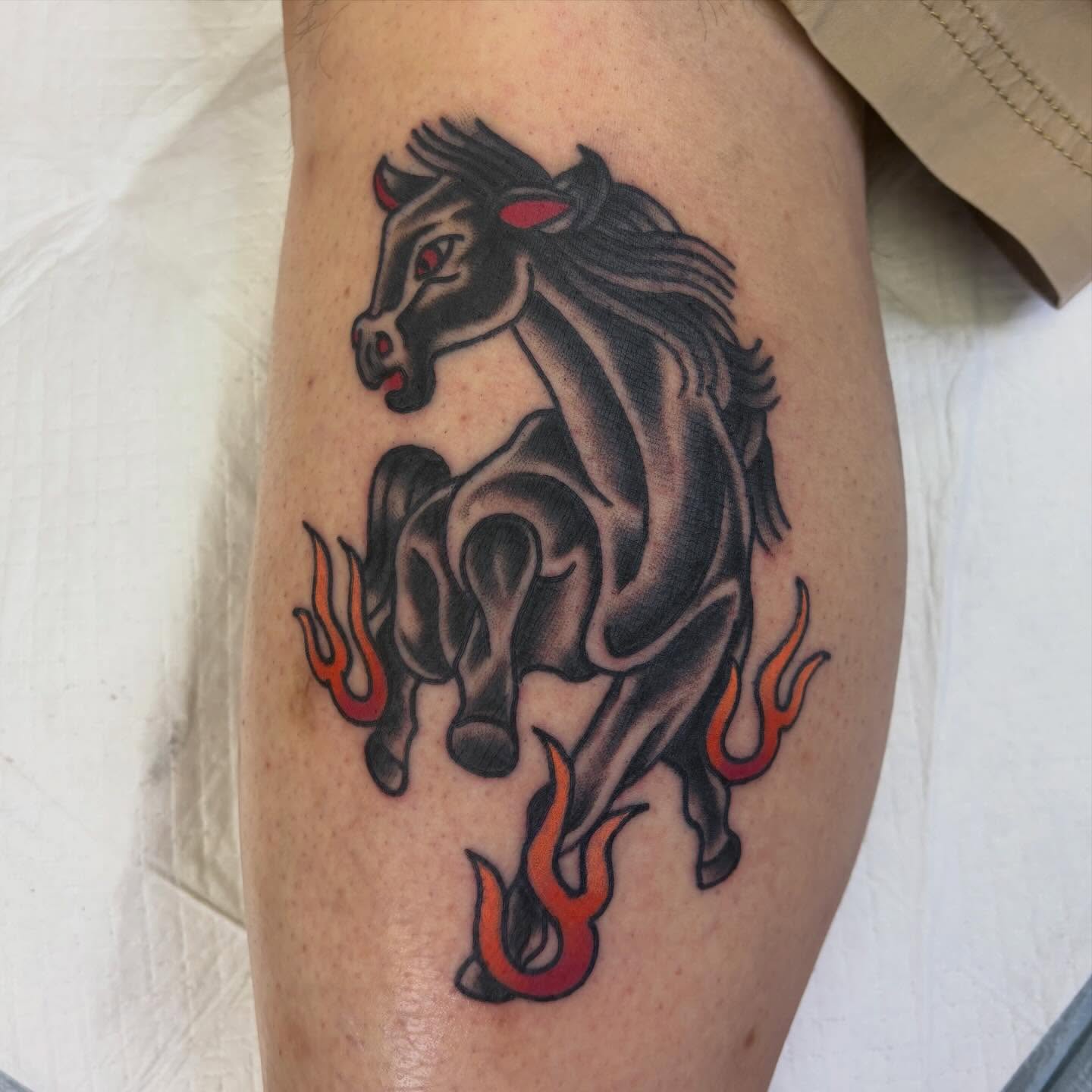 Galloping horse American traditional tattoo on the thigh by Hailey Hermosillo