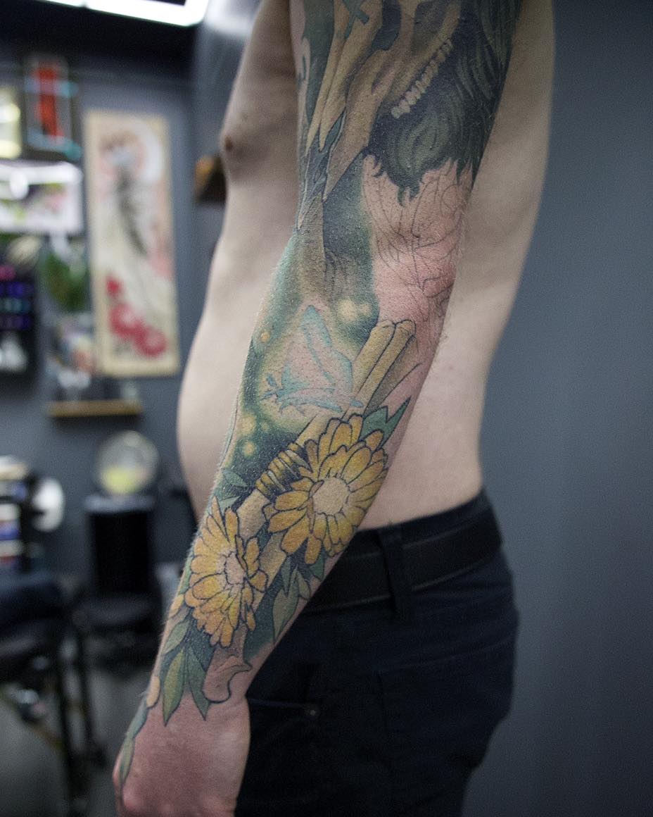 Sunflowers realism tattoo on the forearm by Harper Clark