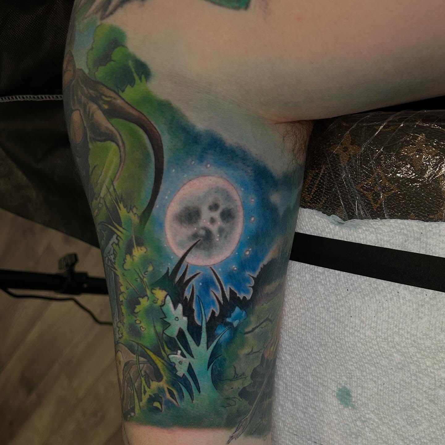 Moonlit forest watercolor tattoo on the forearm by Marvin Silva
