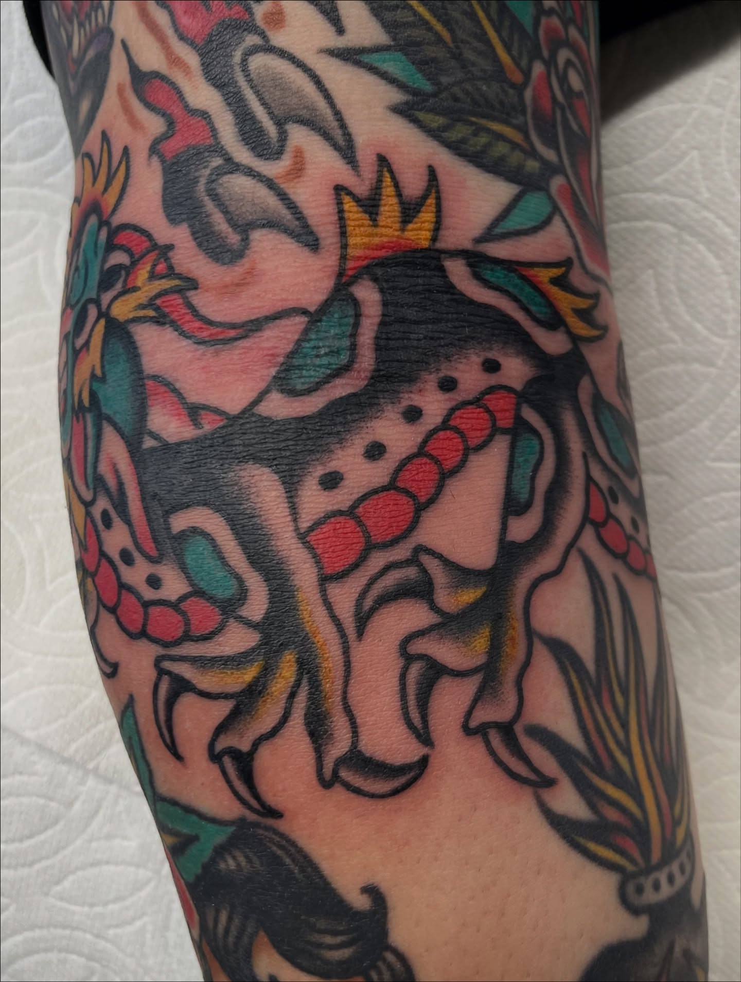 Jester American traditional tattoo on the forearm by Jeff Riley ✞