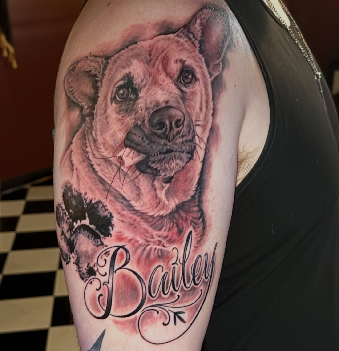 Dog realism tattoo on the shoulder by Geoff “Split” DiVittorio
