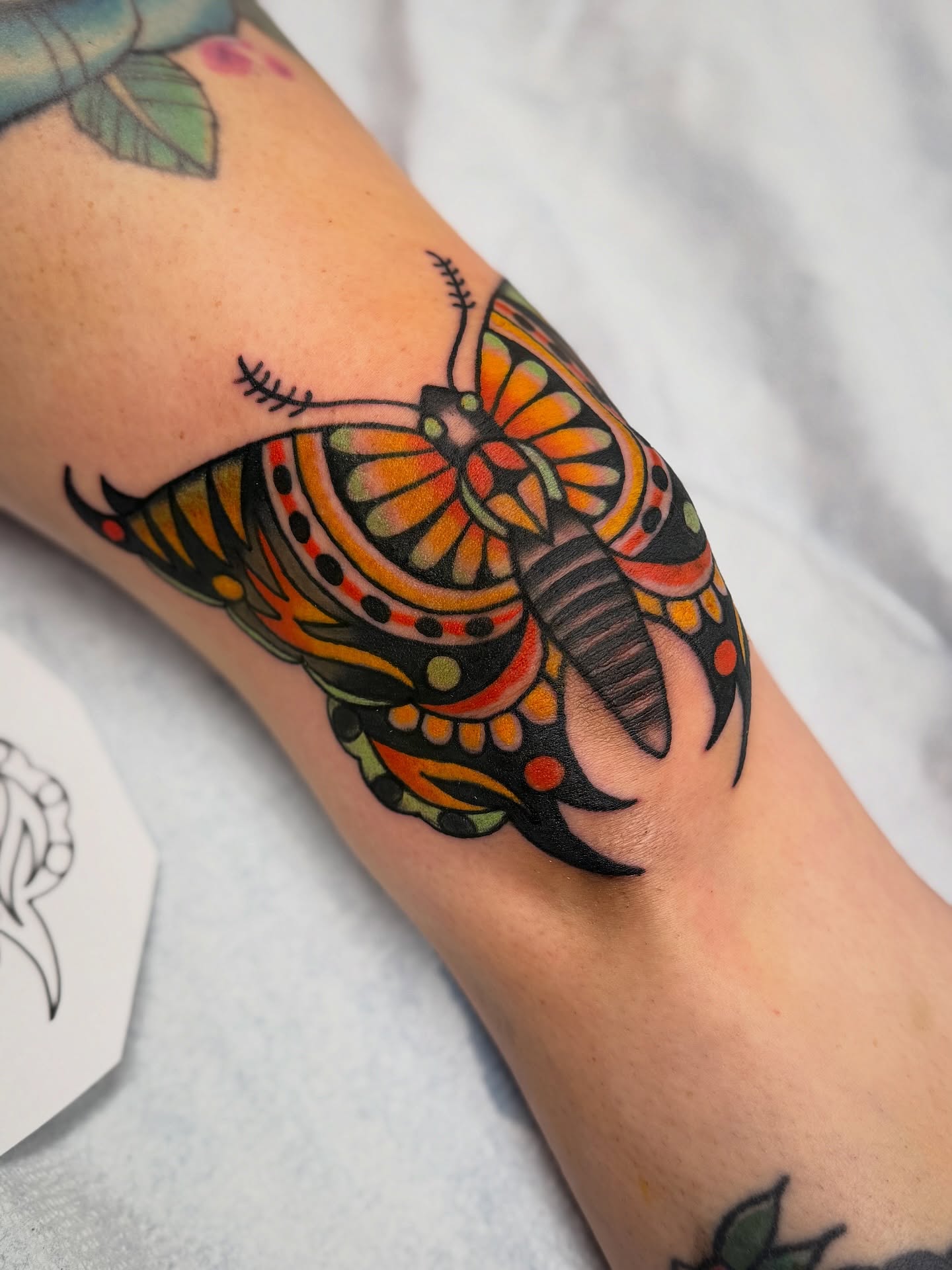 Butterfly American traditional tattoo on the forearm by Shannon Pagliarini