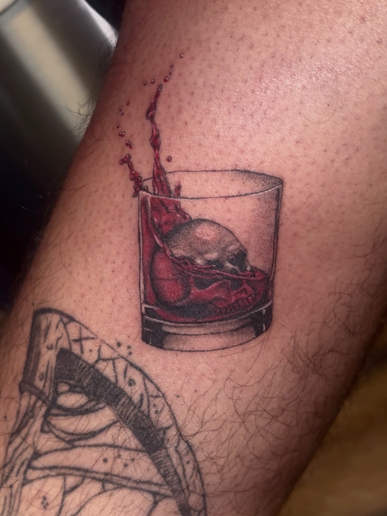 Skull in glass realism tattoo on the forearm by 𝔾𝔥𝓸ş𝔱