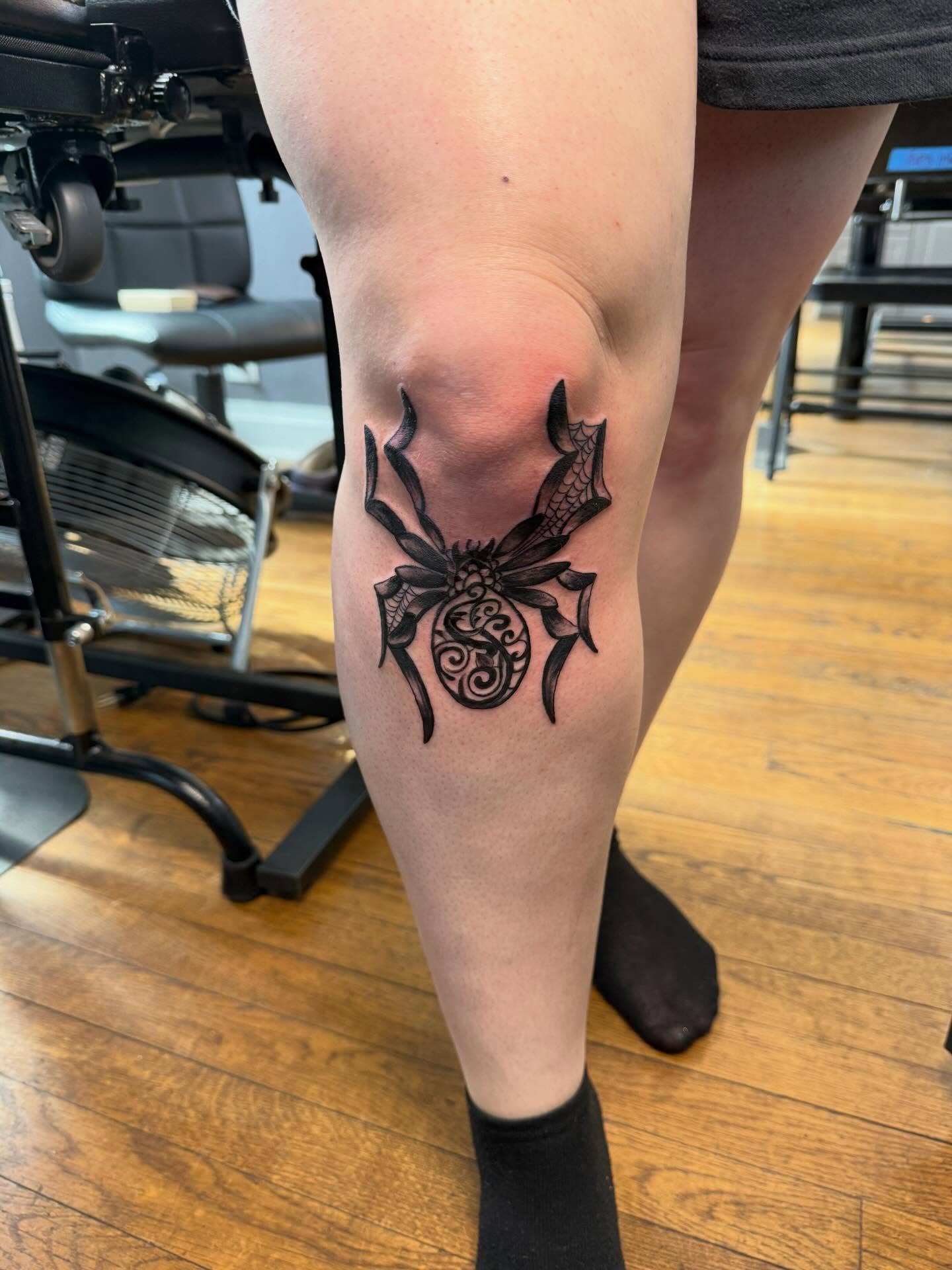 Spider black and grey tattoo on the thigh by Jillian Pardy
