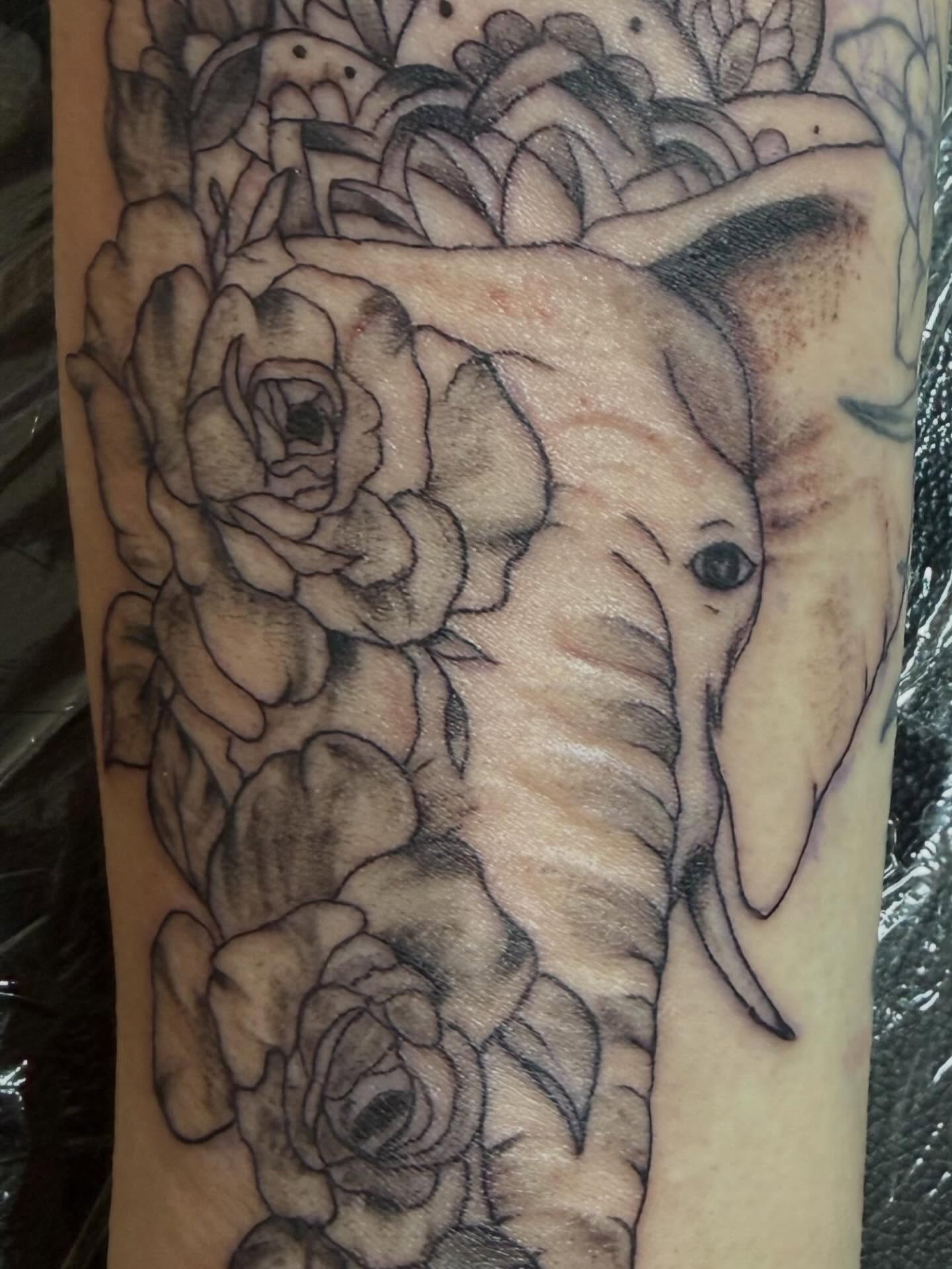 Elephant and roses realism tattoo on the forearm by Jillian Pardy
