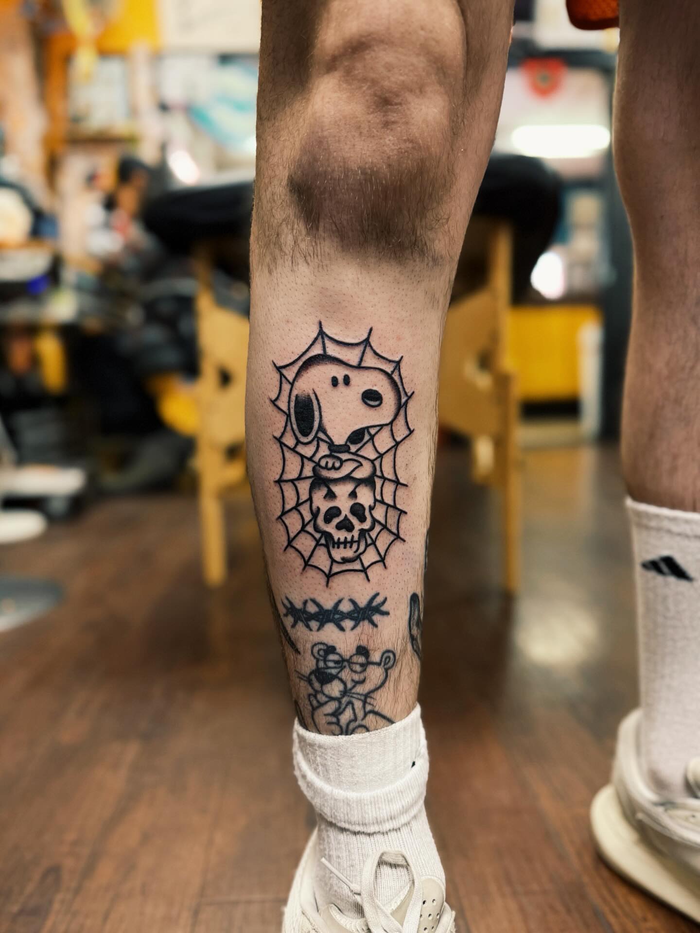 Spiderweb and skull black and grey tattoo on the forearm by @amandahowtattoo
