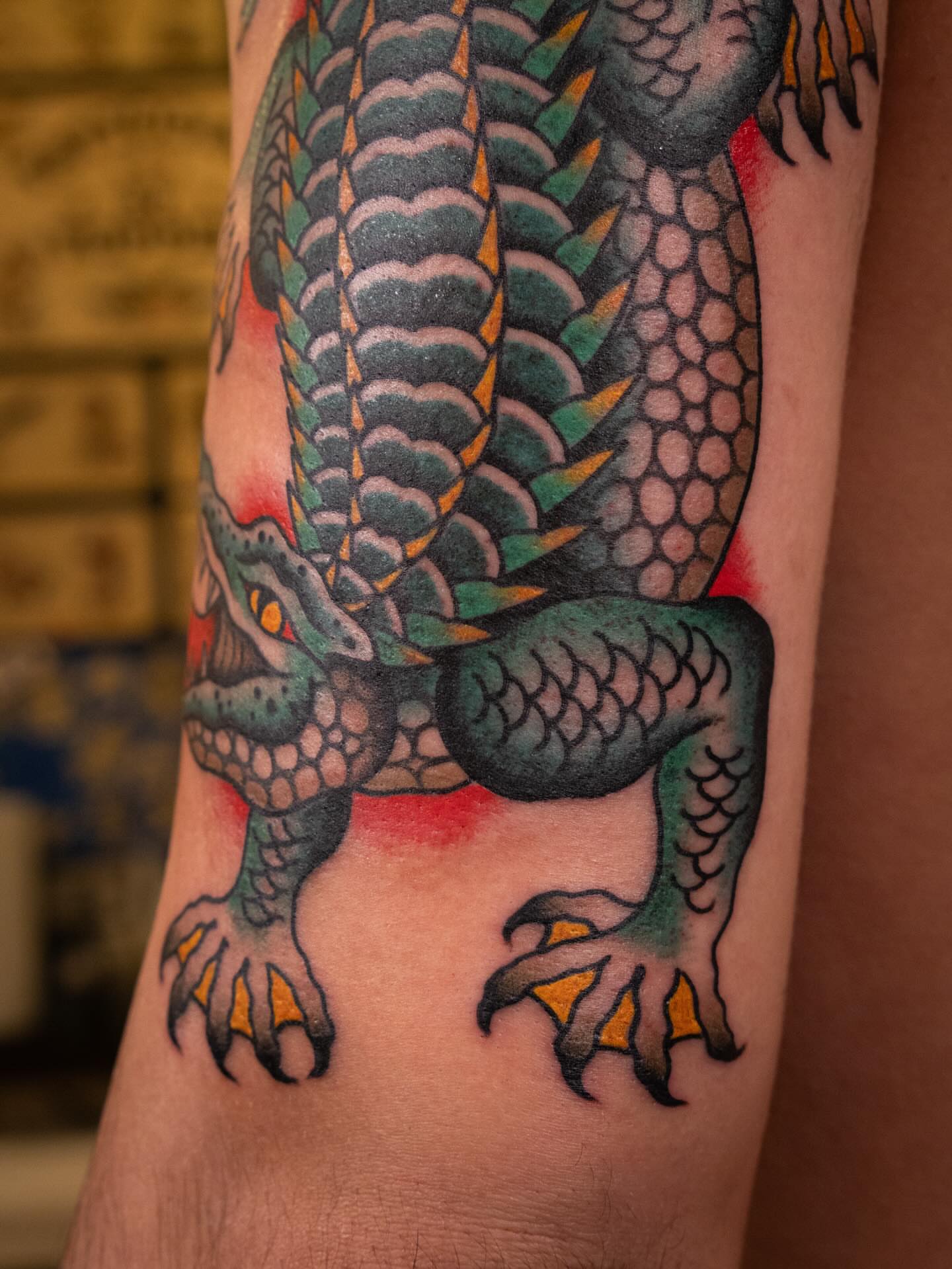 Dragon American traditional tattoo on the forearm by Justin Rakowski