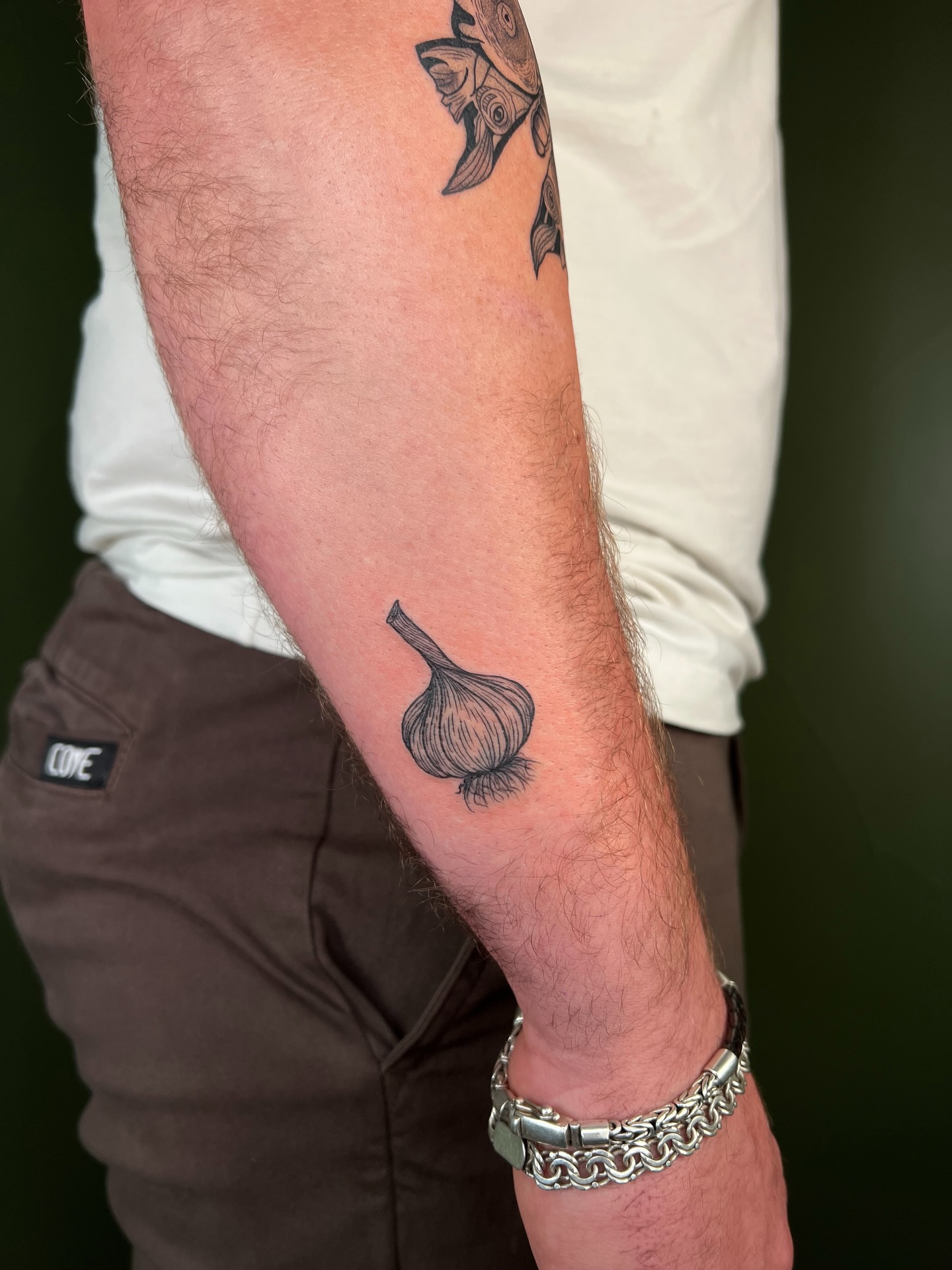 Garlic bulb black and grey tattoo on the forearm by ๐ฅ ๐๐ฅ๐๐ฑ๐ข๐ฌ ๐ฅ