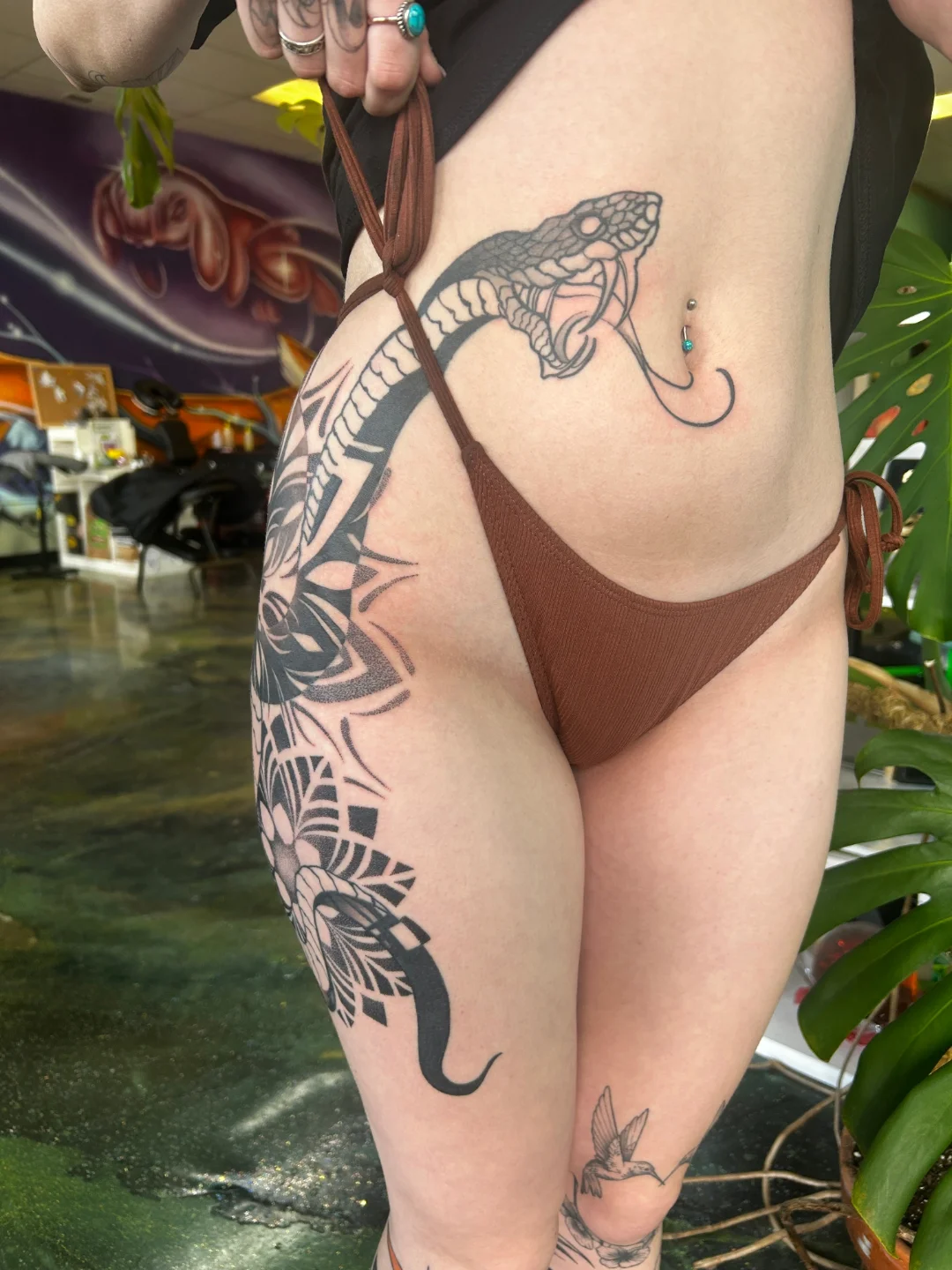 Snake and peony American traditional tattoo on the thigh by Demonic Love Child Tattoos