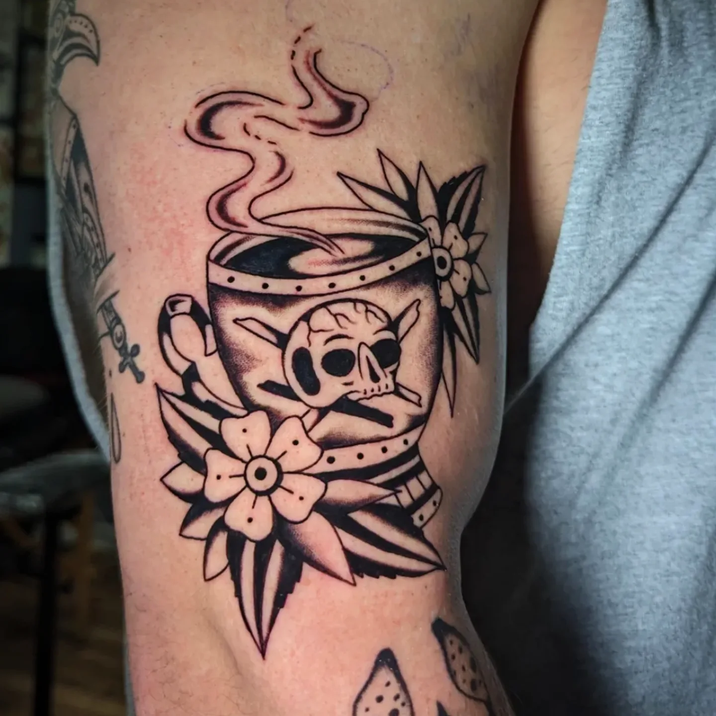 Coffee cup with skull black and grey tattoo on the forearm by joseph palladino