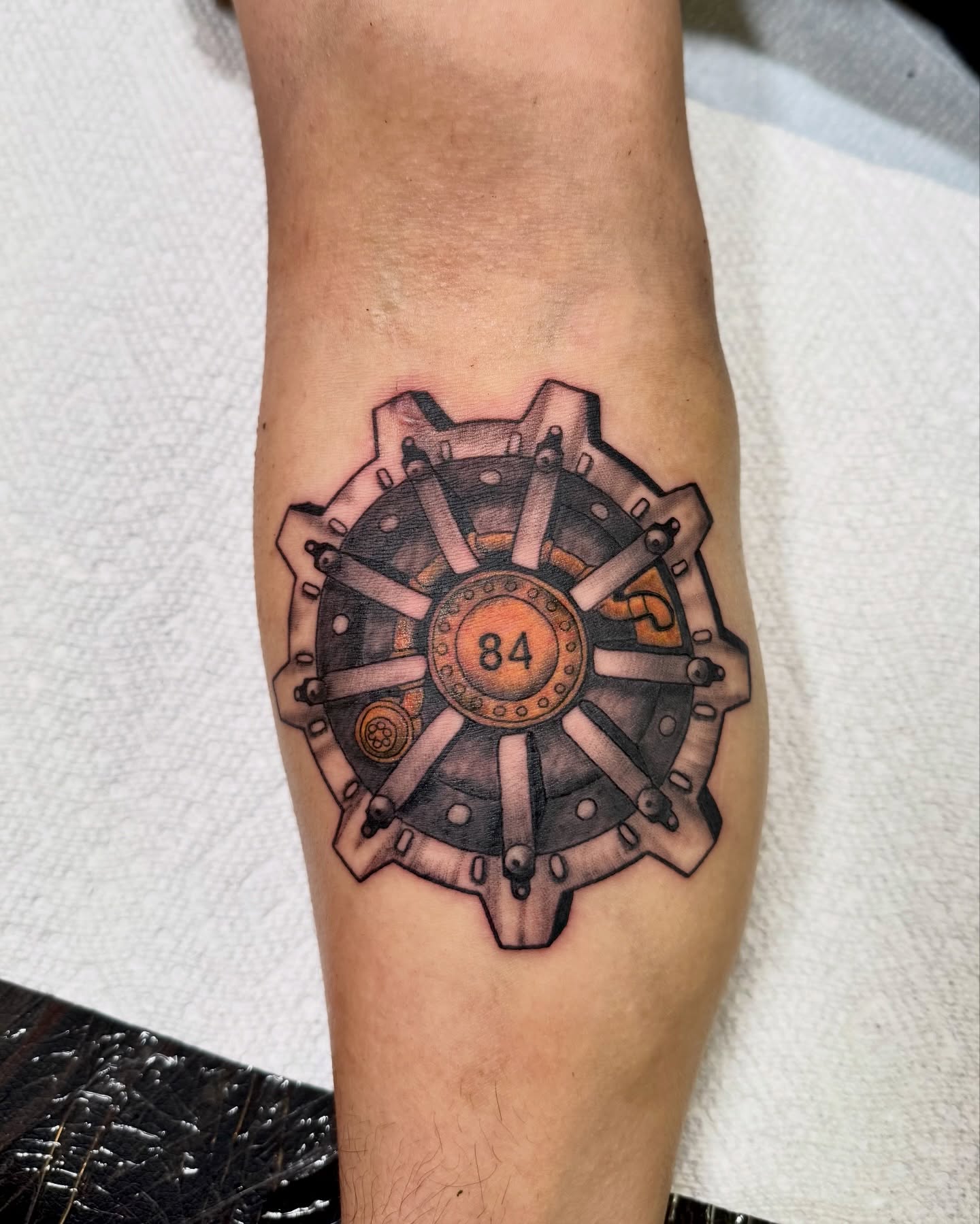 Mechanical gear geometric tattoo on the forearm by Eden Allen