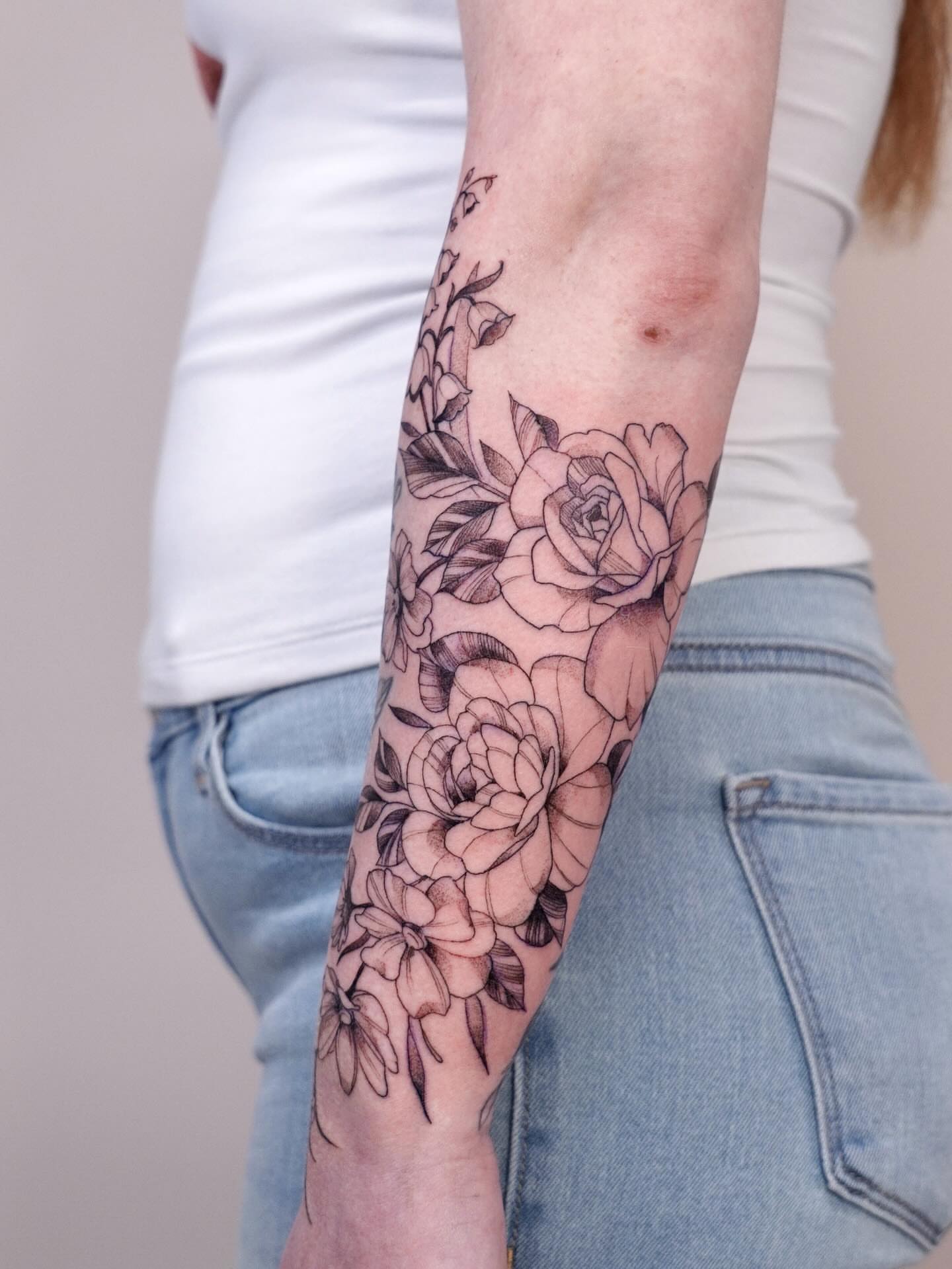 Floral bouquet black and grey tattoo on the forearm by Marianna D D King