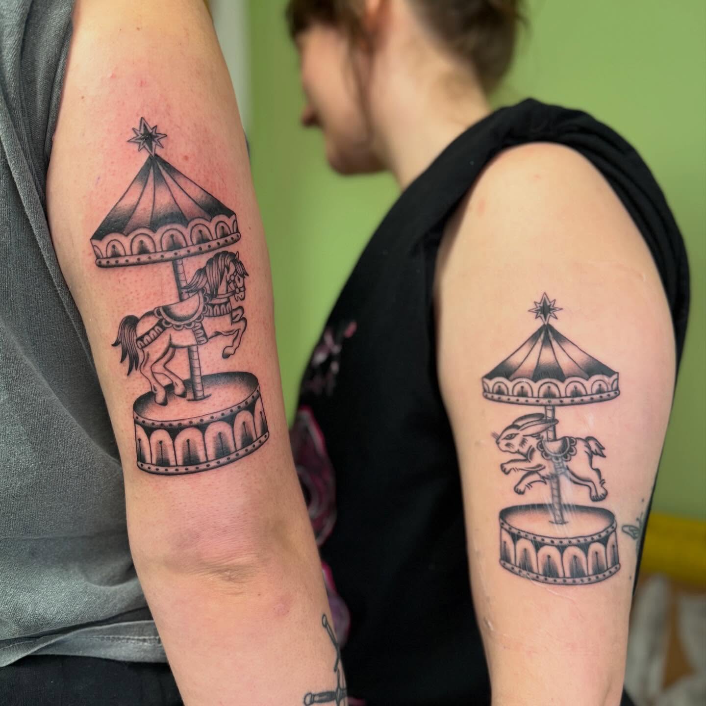 Carousel horse black and grey tattoo on the forearm by charlie