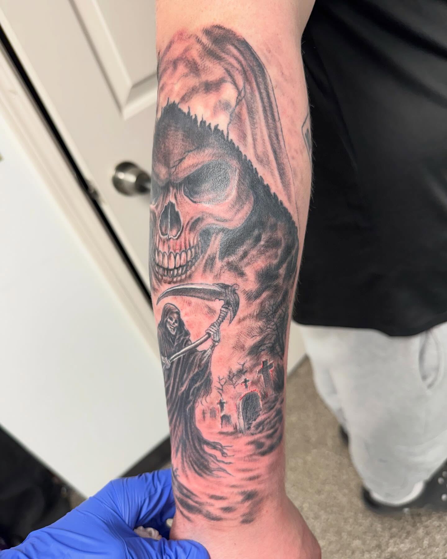 Grim reaper dark realism tattoo on the forearm by Brazun Locker Poloschan