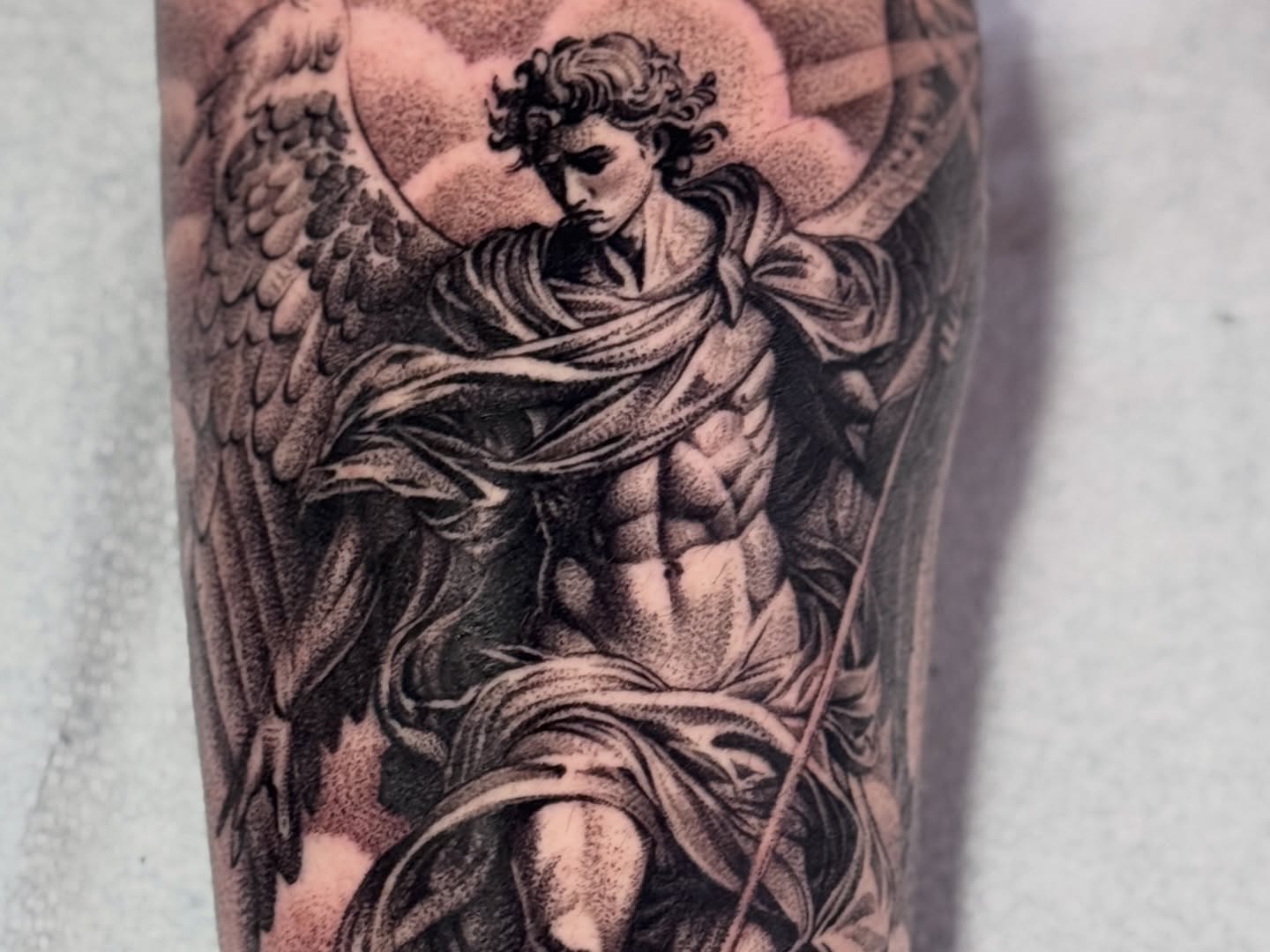Angelic figure realism tattoo on the forearm by Zachary Kaufhold