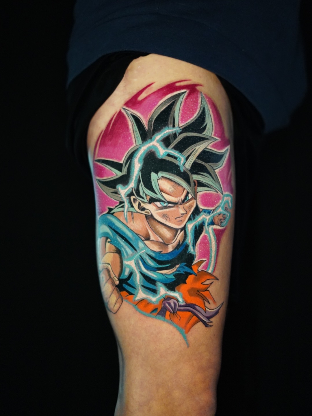 Goku Ultra Instinct anime tattoo on the thigh by Remko